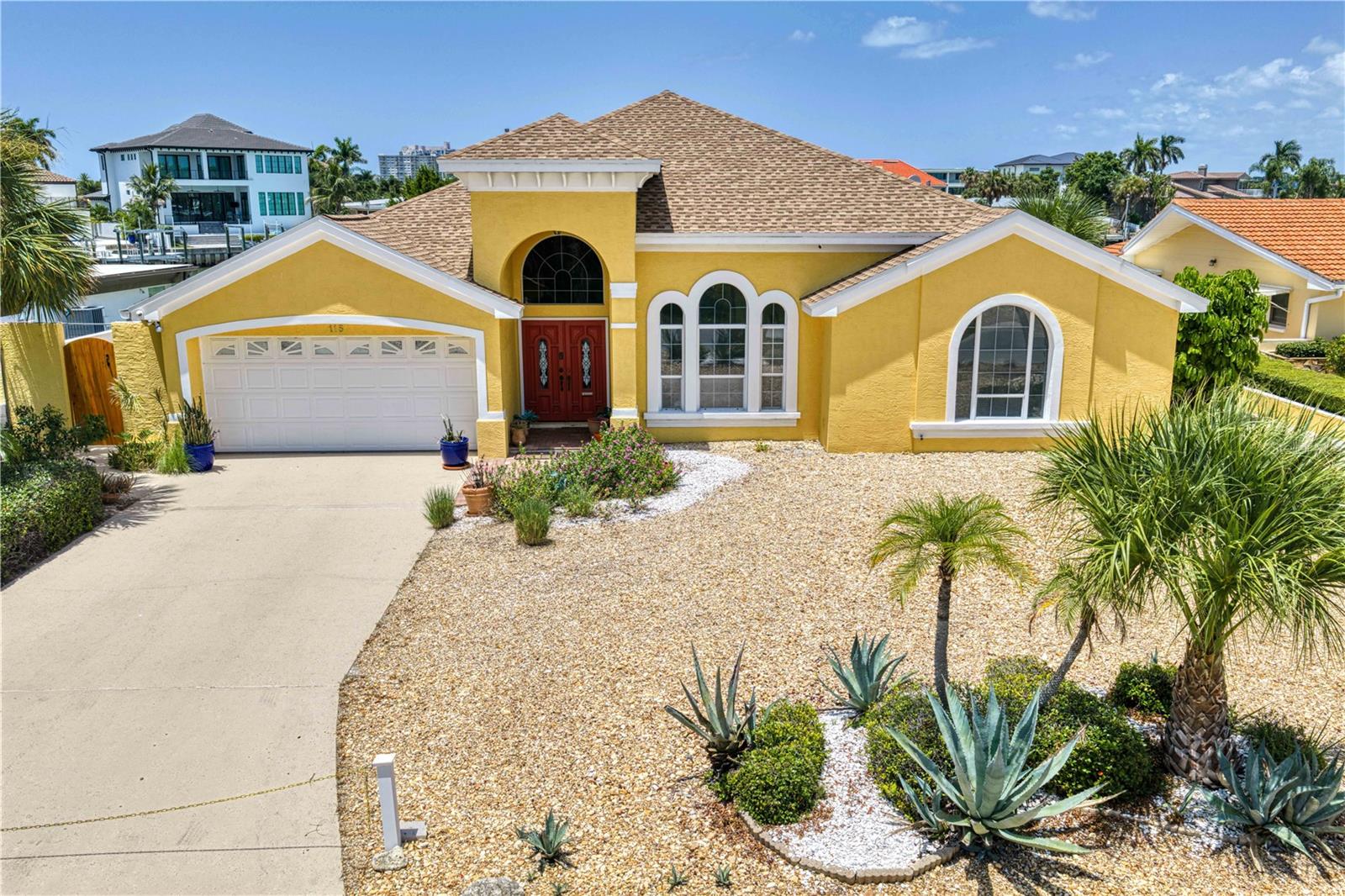 Waterfront Living at Its Finest! Nestled on a quiet cul-de-sac, this beautiful 3-bedroom, 2.5 bath block home offers the perfect blend of comfort, style, and coastal living. From the moment you step inside, you'll be greeted by an open floor plan, soaring vaulted ceilings, and expansive windows that showcase breathtaking intercoastal waterfront views from the main living areas. The spacious layout is ideal for both everyday living and entertaining, with a light-filled great room flowing seamlessly into the kitchen and dining areas. The primary suite provides a private retreat with peaceful water views, while two additional bedrooms offer plenty of space for family or guests. Designed with both beauty and peace of mind in mind, this home features a whole-house generator, tankless water heater, large laundry room with sink, and great storage. Outside, enjoy your own slice of paradise with a newer seawall and private dock, making boating, fishing, and waterfront relaxation effortless. The intercoastal waterways are just moments from the Bay and Gulf by boat. Located just minutes by car from shopping, dining, and entertainment, this exceptional property also includes private beach access on private Belleair Beach, allowing you to enjoy the best of both waterfront and beach lifestyles. Whether you're looking for a full-time residence or the ultimate coastal retreat, this home delivers an unbeatable combination of location, amenities, and spectacular views. Schedule your private showing today and experience waterfront living at its best!