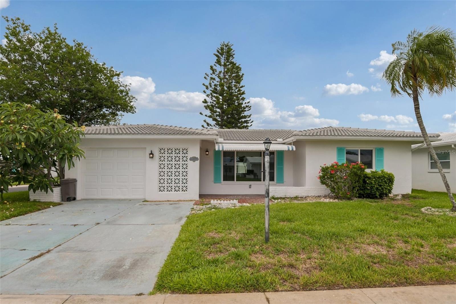 Welcome home to this well-maintained 2-bedroom, 2-bathroom residence nestled within a desirable 55+ golf cart-friendly community in a convenient Pinellas Park location. Offering a comfortable and functional floor plan, this home features spacious living and dining areas that create an inviting atmosphere for both everyday living and entertaining. The kitchen provides ample cabinet and counter space, making meal preparation a breeze while remaining open and accessible to the main living areas. The generously sized primary suite serves as a relaxing retreat and includes a large walk-in closet along with a private en-suite bathroom. The secondary bedroom is well-proportioned and ideal for guests, family members, or a home office. A second full bathroom adds convenience and flexibility for residents and visitors alike. Step outside and enjoy the Florida lifestyle with outdoor space perfect for relaxing, gardening, or enjoying your morning coffee. Whether you're looking to downsize, simplify maintenance, or find the perfect seasonal residence, this property offers an exceptional blend of comfort, convenience, and community living. The HOA fee provides outstanding value and includes cable TV, internet, water, sewer, trash removal, lawn care, roof repairs and replacement, and exterior painting, allowing for truly low-maintenance ownership. Residents enjoy access to a variety of amenities, including a community clubhouse, heated pool, shuffleboard courts, and a full calendar of social events and activities that make it easy to stay active and connected with neighbors. Conveniently located near shopping, dining, parks, medical facilities, and major commuting routes, you'll enjoy easy access to everything Pinellas County has to offer. Don't miss the opportunity to own this charming home in a welcoming and centrally located community.