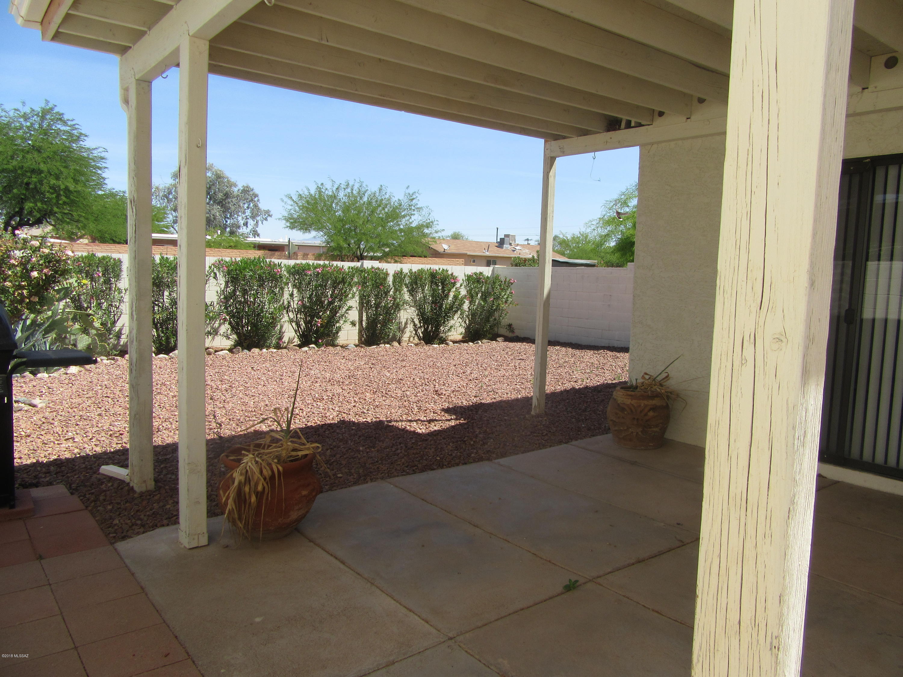 Enter through gate to the court yard to this wonderful open Great room town home. Cozy fireplace, Mexican tile floors, large master bedroom with walk-in closet, lots of storage, and a block wall surrounding the back yard. Solar City lease on home saves on the electrical bill.