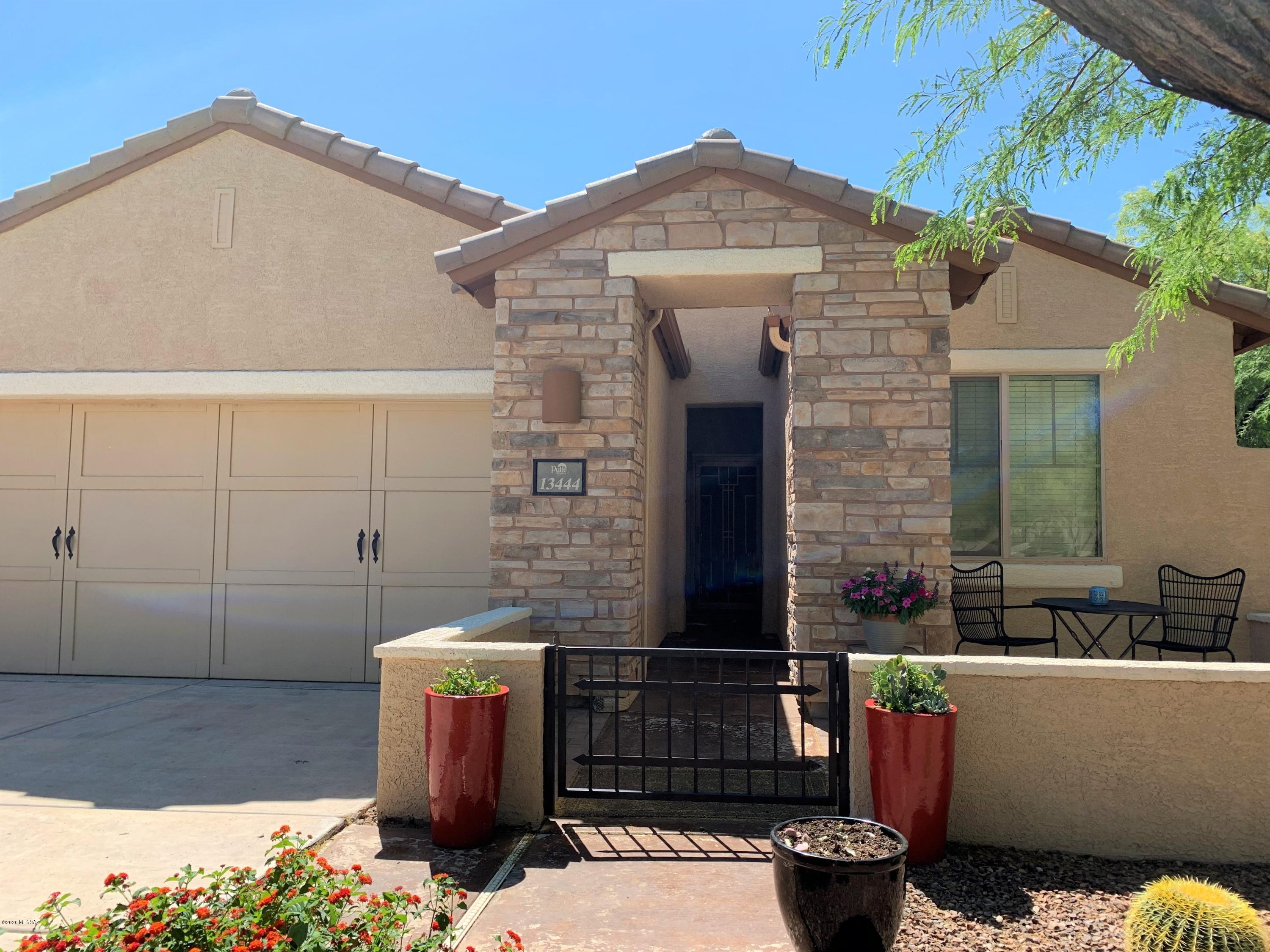 Unobstructed, panoramic Catalina Mountain views!  Ready to move in, just bring your suitcases, all furnishings available under separate bill of sale! This home is in pristine condition with a graceful, flowing, split bedroom floorplan and a terrific lot location.  The Kitchen is equipped with GE Profile Stainless appliances including a gas 5 burner stove, granite counter tops, glass tile backsplash, beautiful cabinetry and a breakfast bar.  The Great Room features a gas fireplace lined with glass beads and mountain views from your sofa!  A roomy master bedroom offers lots of space for furnishings and a fabulous picture window view.  Master bathroom has plenty of elbow room with  a dual sink vanity, soaking tub and separate shower.  A  well organized closet sits off the master bath. On the other end of the house you'll find 2 guest bedrooms, the full sized guest bath and the den.  The den is perfect for working from home or as a playroom/guest room.  You'll love the east-facing backyard with an outdoor kitchen and shade beyond the covered patio in the late afternoons.  Love to golf? Practice your putting on your very own putting green! Virtual Tour in photos.