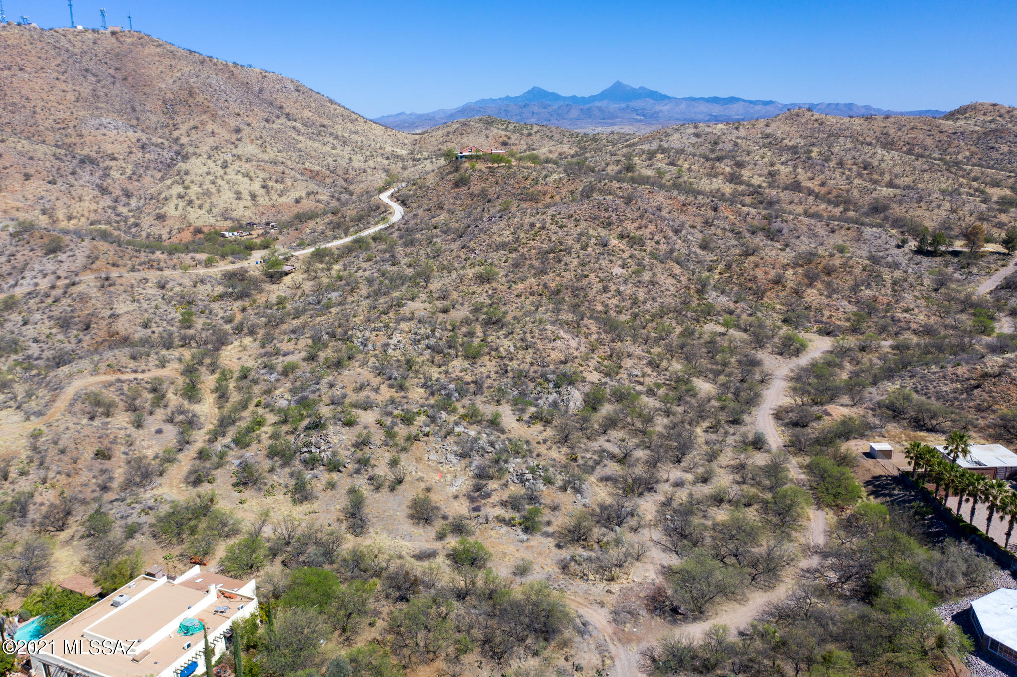 Great Opportunity  awaits you in Vista del Cielo. A paved entry way leads you to 4.7 acres surrounded by beautiful Mesquite trees . Enjoy building your dream home on the hilltop with amazing views.
This size lot allows for privacy, pool, tennis court, basketball court, guest house and just about anything your heart desires.