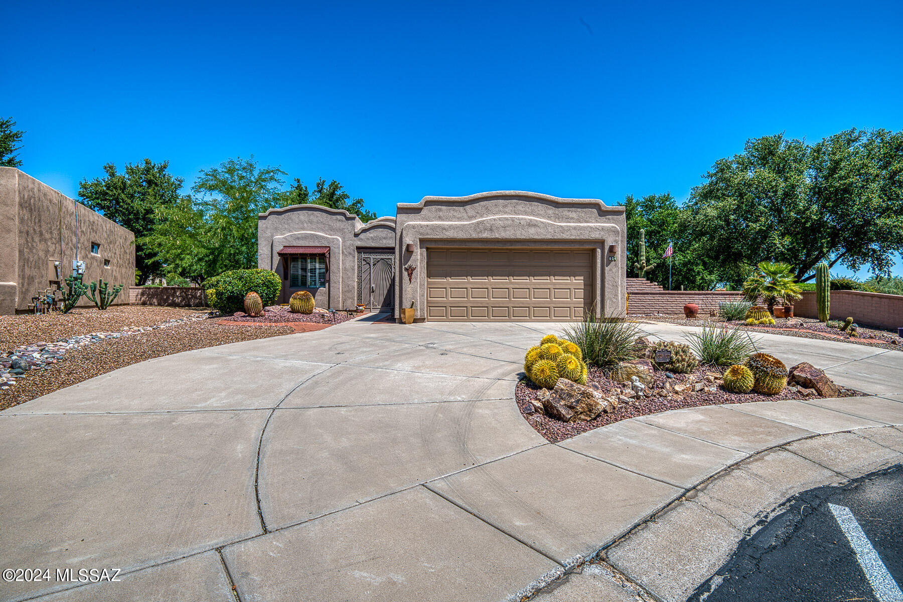 Enjoy the Southwest flavor of this beautiful  home on a large corner lot.  Some of the features include refaced kitchen cabinets, plantation shutters, enclosed private front entrance, bee hive fireplace, SS appliances, all tile floors, roll-in shower in main bath, 3 year old HVAC  Lovely mountain view as well as the greenbelt.  Great outdoor  areas for entertaining.  old. Furnishings available by SBOS.