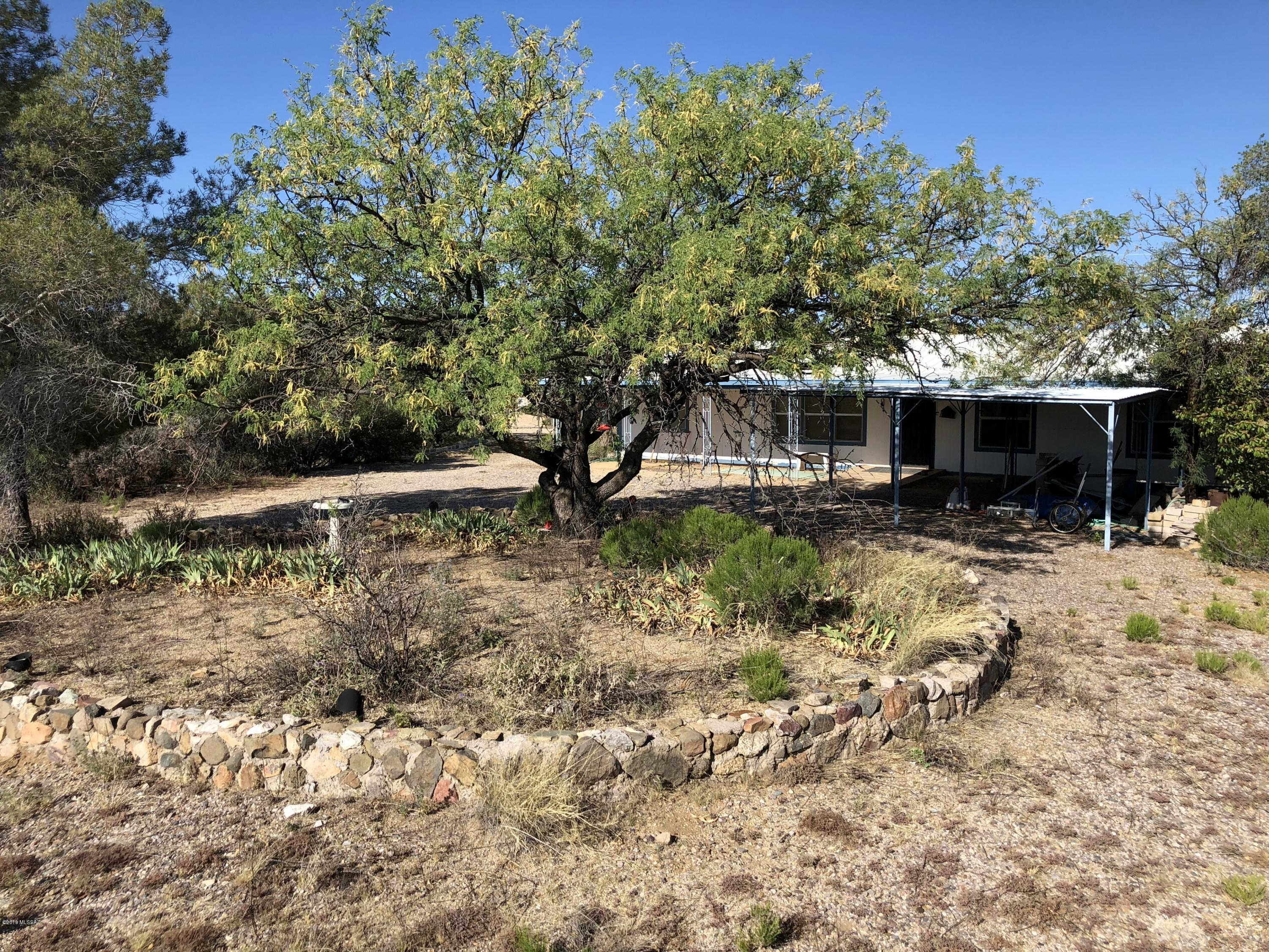 7.23 acres with 360 degree views in the heart of Oracle! Existing 3 bedroom 2 bath mobile home can be fixed up and occupied, or removed so you can build your dream home.