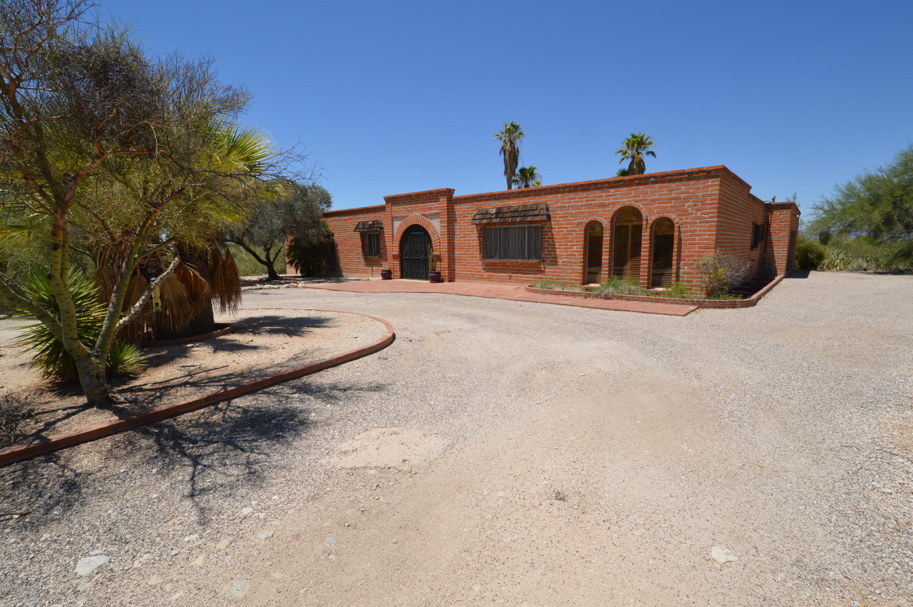 Magnificent 4 Bedroom home in the Catalina Foothills! Gorgeous burnt adobe construction with lots of artistic touches that make it really stand out! Nearly 2700 square feet of home provides an abundance of space both personal and common! Spacious kitchen with beautiful tile and loads of counterspace! Enormous covered patio overlooks the huge pool and lovely backyard! You're going to LOVE this home! All you have to do is CALL TODAY!
