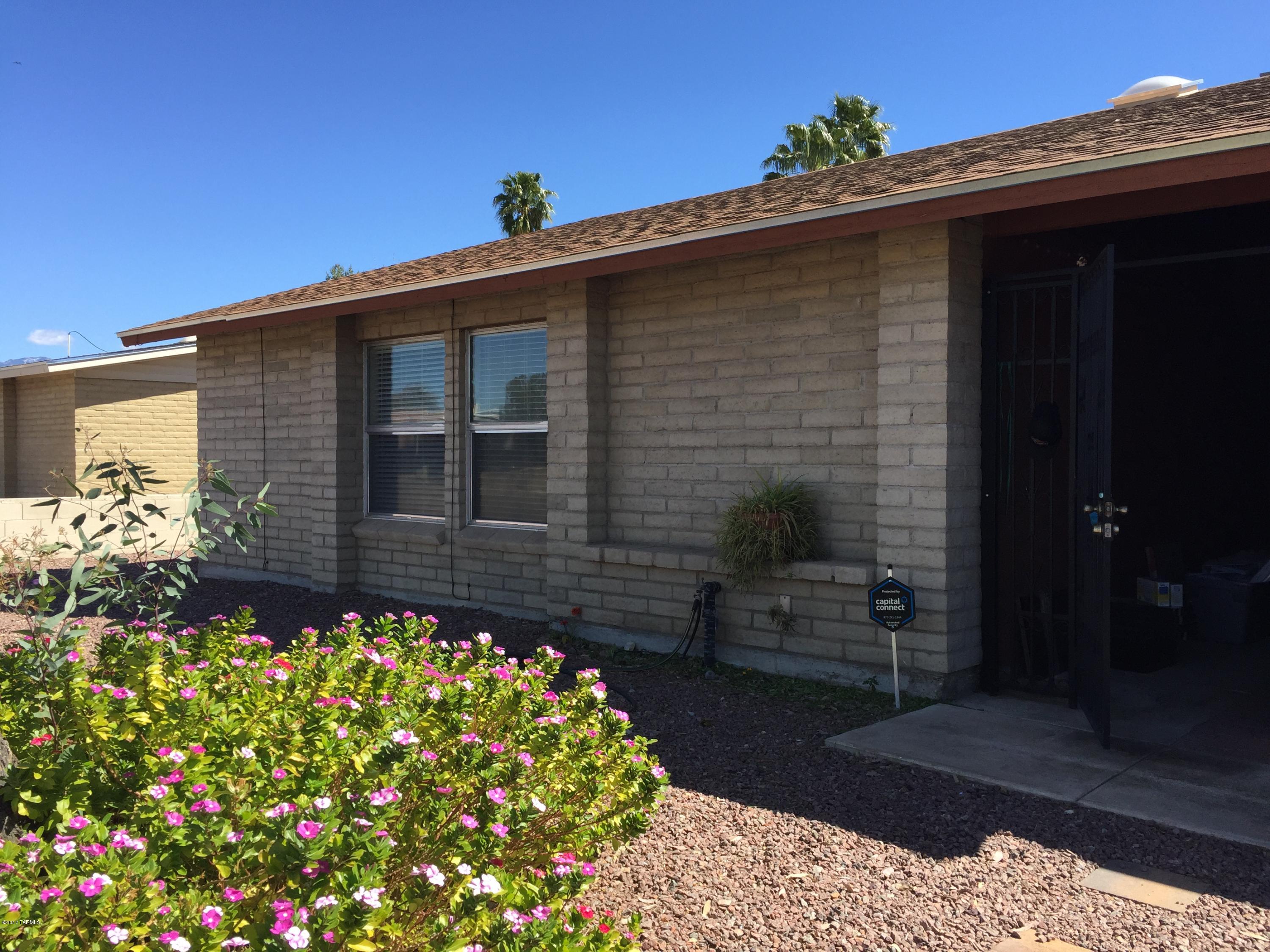Tile everywhere but bedrooms! Rocked fireplace in living room. Spacious floorplan, open kitchen and ample backyard including covered patio. Great Northwest location. Wont last long!