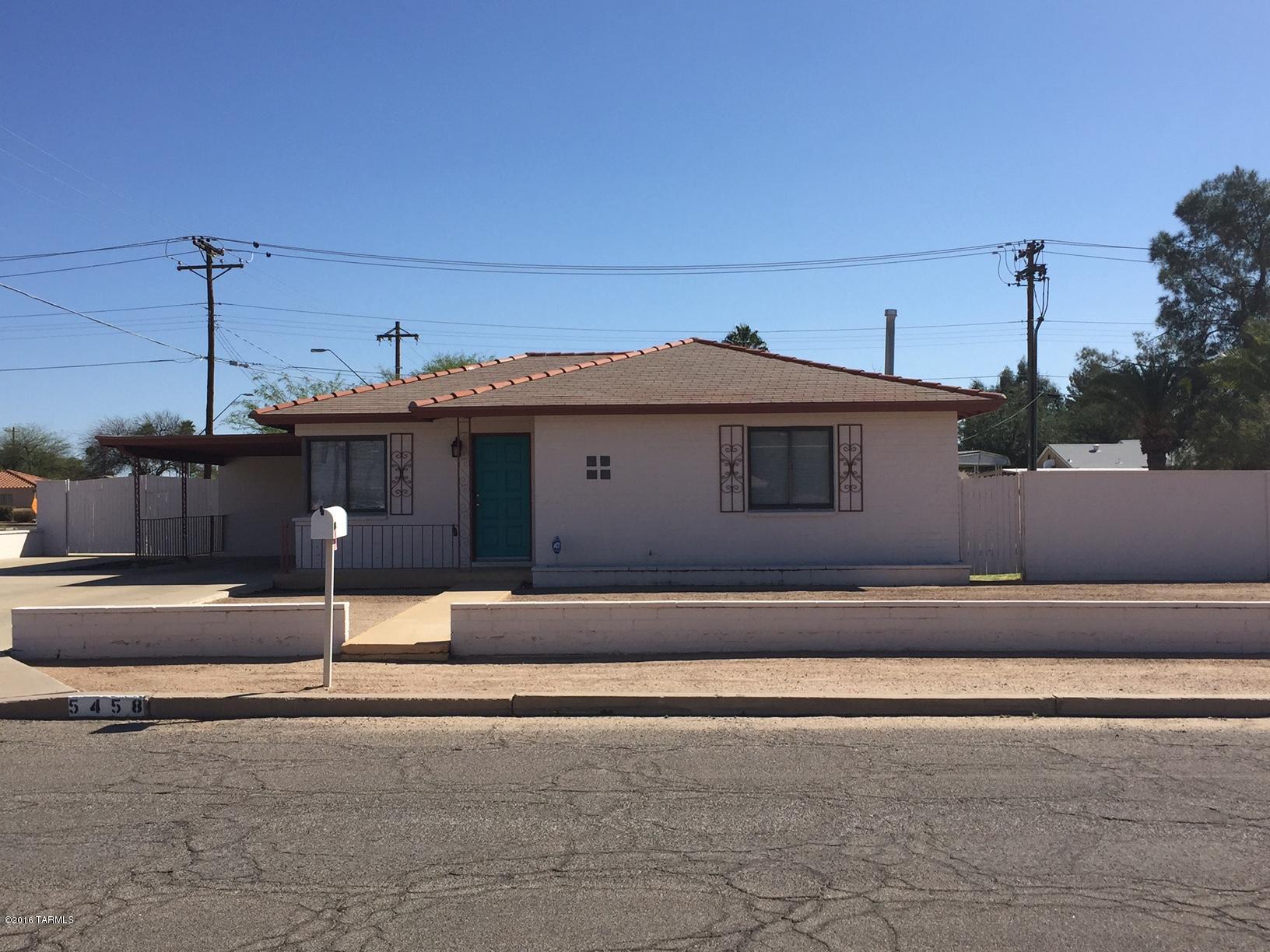 Charming Southwest Bungalow centrally located  near TMC, Costco, bus lines etc.  2 lge bedrooms, HUGE multi-purpose room opens to expansive backyard w/ double gate for extra parking of  vehicles & toys. Laundry/utility room w/abundant storage. Perfect for studio or crafts. Home lovingly maintained.  Large lot with lots of off street parking makes this perfectly Poised for possible business zoning.  Furniture available for sale.