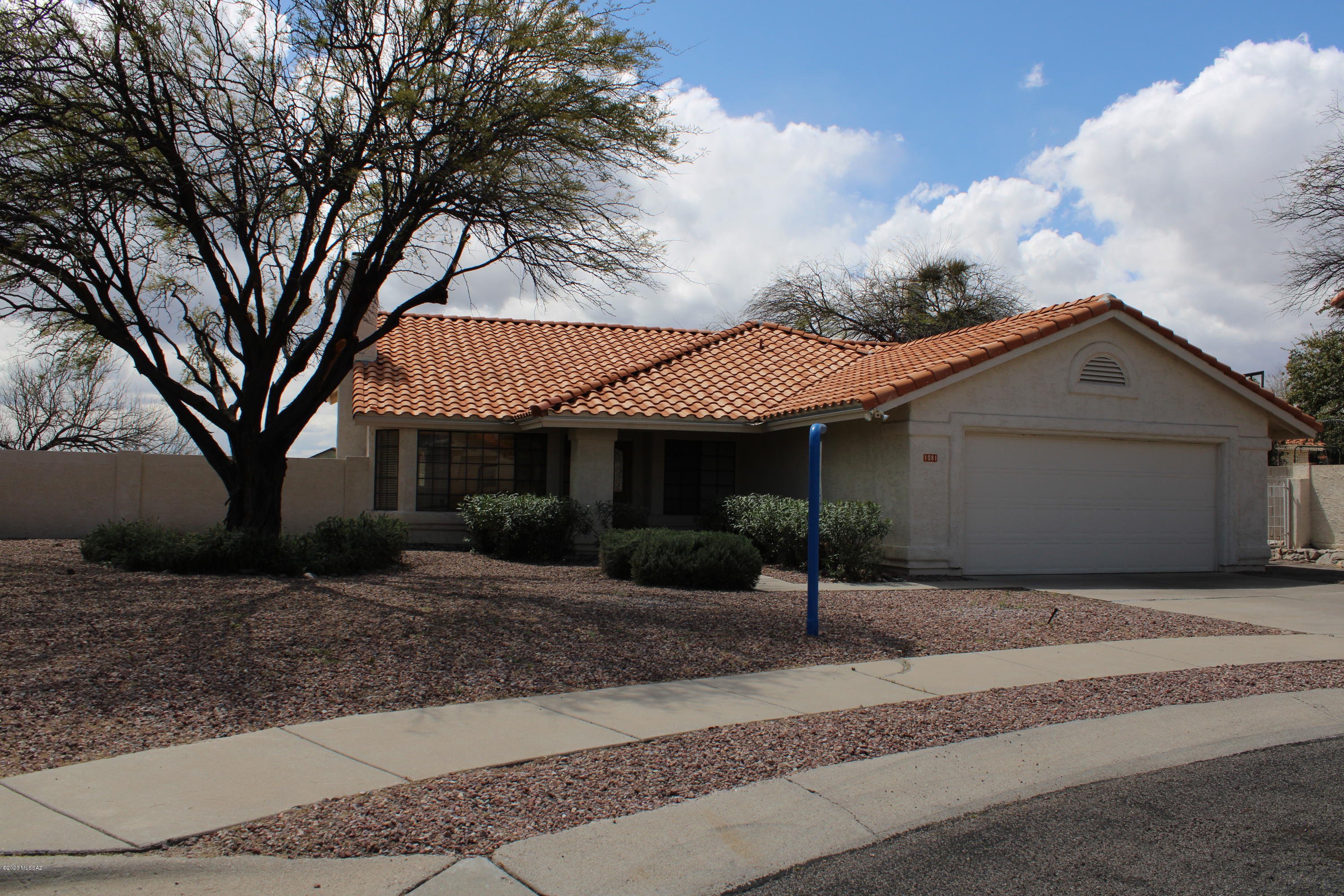 Private cul-de-sac lot with one neighbor. View fencing to common area and Pusch Ridge views. New roof over this 4 bedroom home - with newer kitchen appliances. Including refrigerator! Enter to cozy living room with fireplace off of the formal dining room. Kitchen sink overlooks backyard and views of mountains! Exit off the family room to flagstone patios! Ceiling fans and blinds through-out home. Bonus cabinet/counter in hallway. Washer/dryer convey too! Poly pipes replaced through out (except one section in kitchen from ceiling to sink). See Virtual Tour option with Photos.