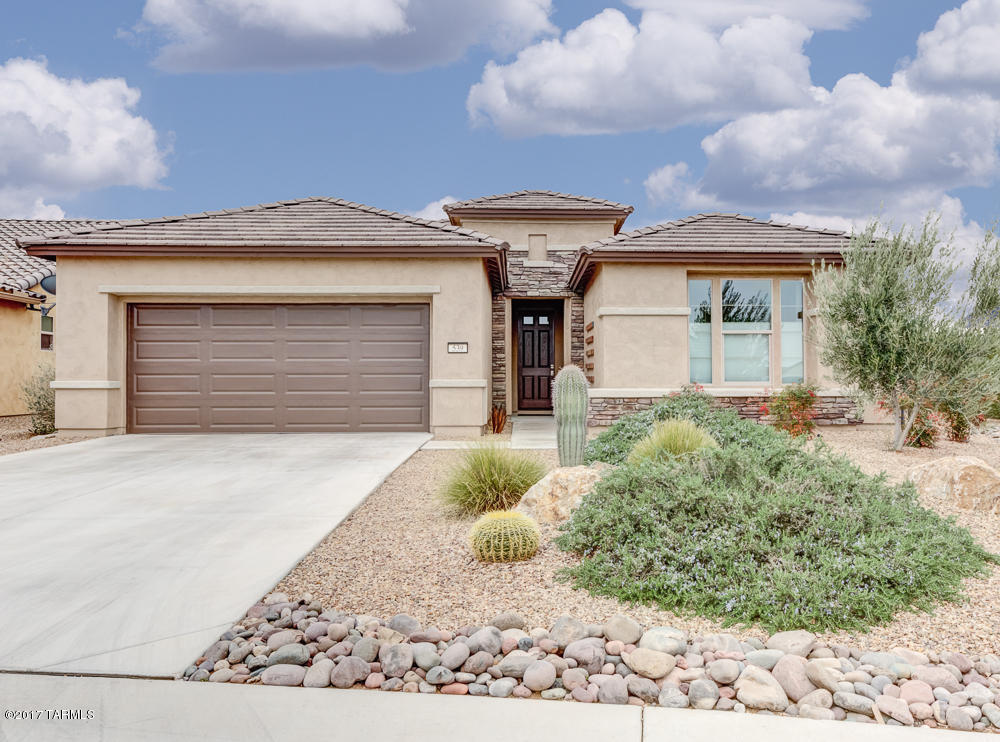 If privacy and spectacular views of Santa Rita Mountains and Elephant Head are important, consider this wonderful split floor plan with neutral color palate and architectural details (like an expanded master closet)! Stainless steel appliances, granite counter tops and an open floor plan to kitchen, dining and living areas. Extra storage closets in bathrooms. Natural desert landscaping with drip system available for future planting.  All appliances included.  Nothing to do but grab your golf clubs and enjoy!