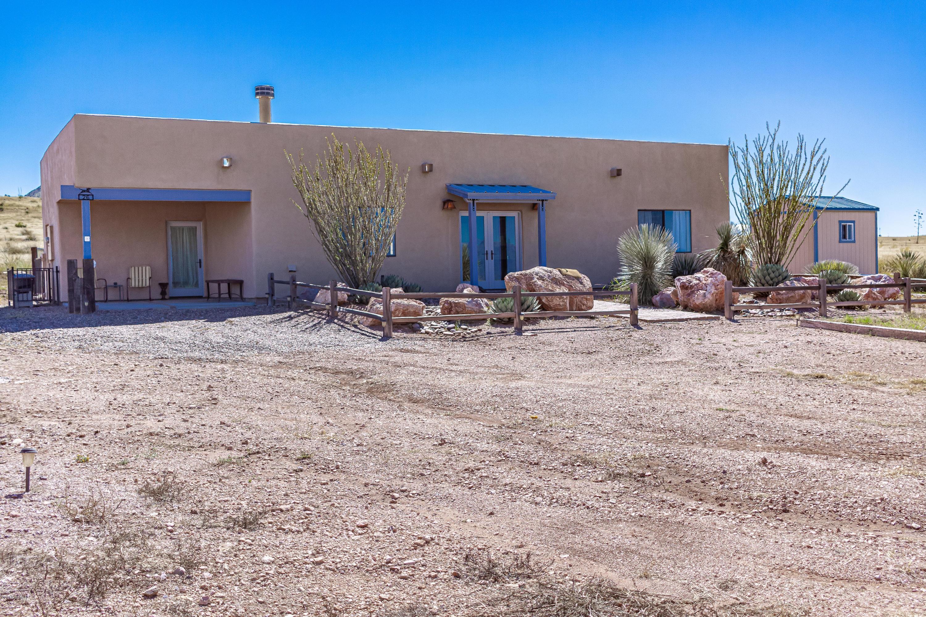 Spectacular views of Biscuit Mountain and the surrounding valley is the backdrop for this 2 BD, 2 BA home on 10 acres with direct access to BLM land is sure to impress. Elegantly simple lines combined with craftsman details, beehive fireplace, lovely tile accents, wood flooring and totally furnished. Easy care low maintenance landscaping w/custom iron-fenced backyard where you can enjoy the awe-inspiring views and wild life. Bring your horses and your bags that's all you'll need. Bring your bags that's all you'll need.