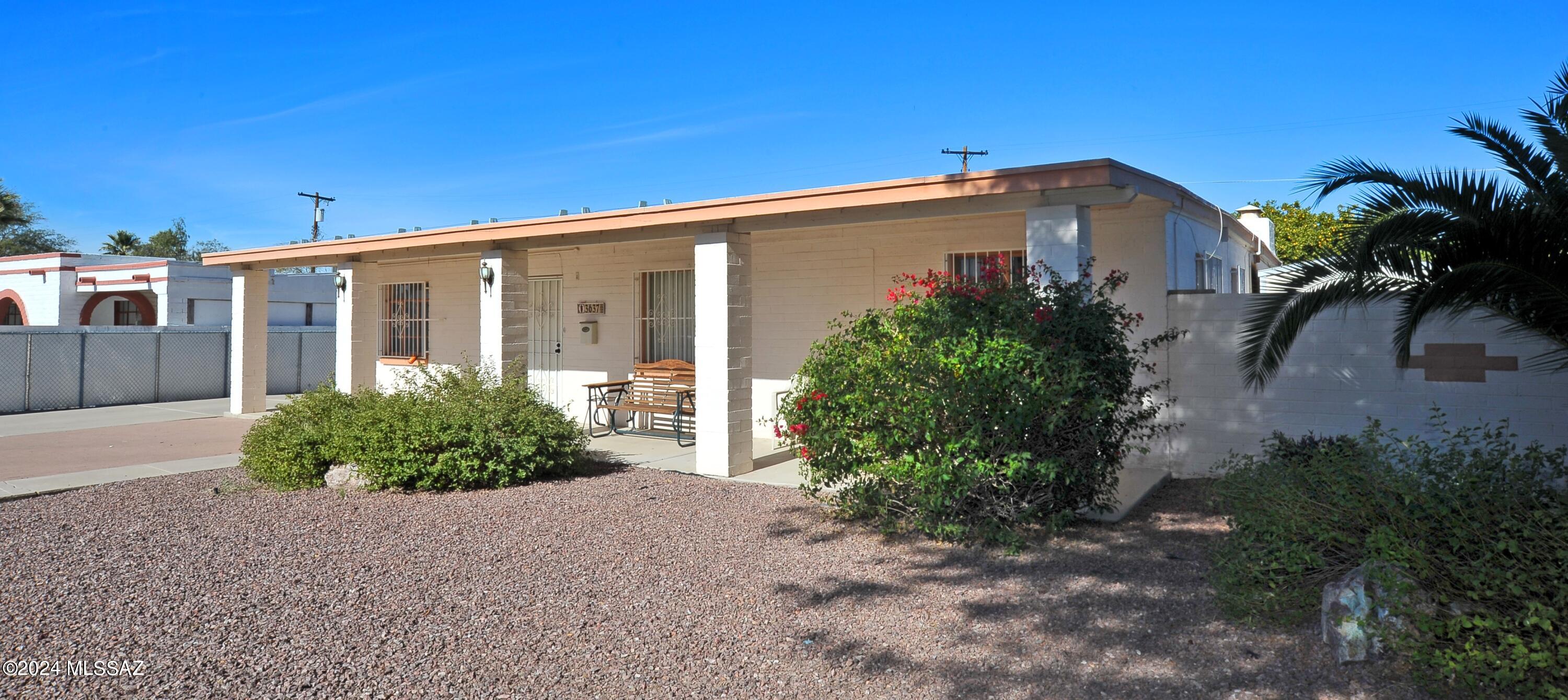 Amazing yard, 2 car garage plus solar! Beautiful 3 bedroom 2 bath in the heart of Tucson with separate garage/workshop. Fresh, clean & newly remodeled in well established neighborhood. Freshly painted with solid surface flooring throughout (no carpet).  Spacious kitchen with large center island & walk in pantry.  Beautiful granite countertops, appliances include: refrigerator, gas stove, dishwasher, washer/dryer. Separate living rm & family rm.  Air conditioning & ceiling fans. Wood burning fireplace in family rm. Beautiful backyard with patio, ramada & fruit trees. Room for RV parking. Close to Reid park & Zoo, shopping, buslines, UofA & so much more! 2 pets OK with breed restrictions &  pet rent. Non-smoking home. 1 yr minimum lease. $45 app fee per adult. Renters insurance required.
