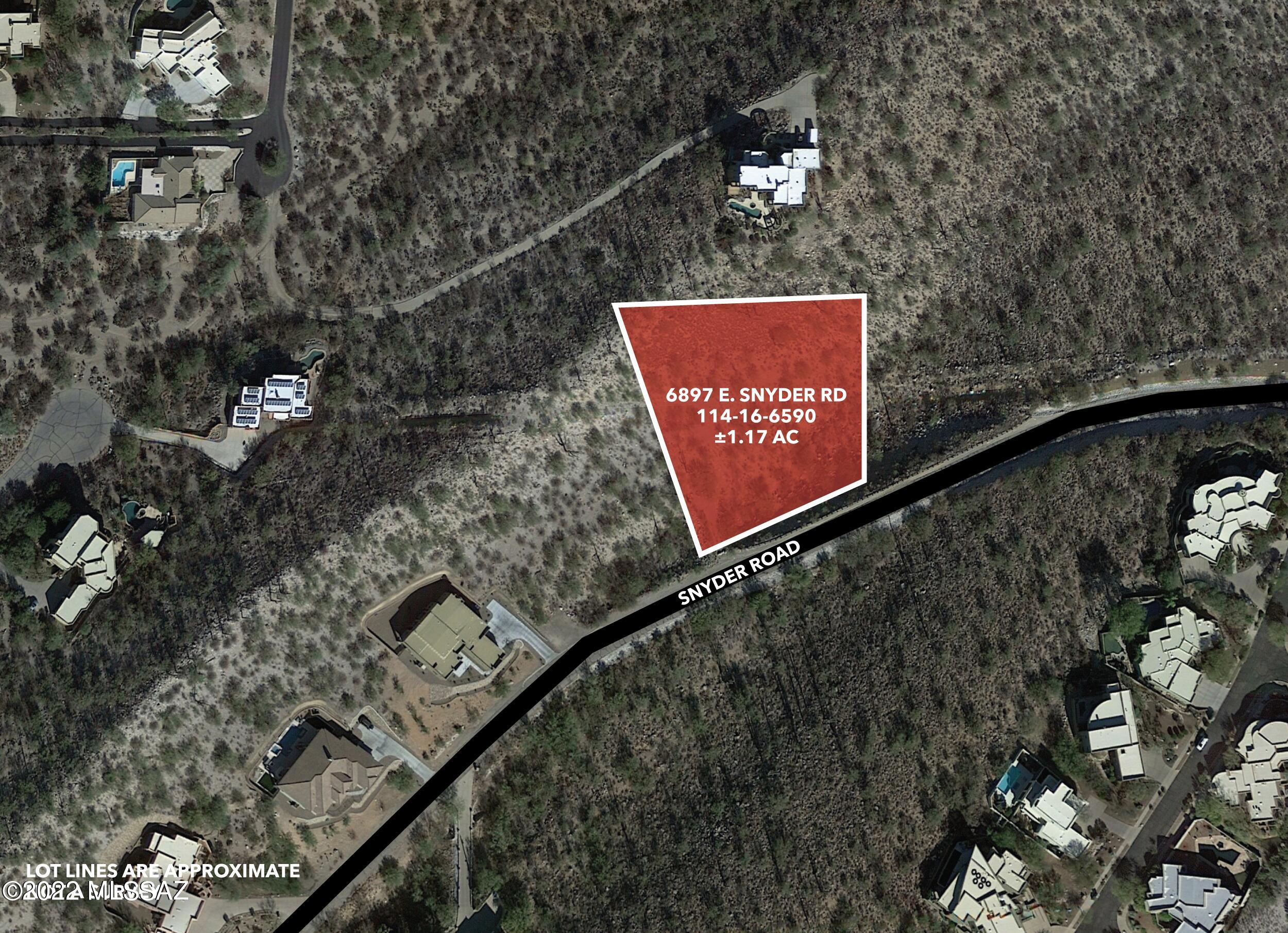 Little Ridge Lot 1 is a Custom Large +/- 1.17 acre Lot near Kolb & Snyder in Tucson AZ.  In the beautiful Little Ridge subdivision of the Foothills!  Fully improved with all utilities.  Lot sits up high and has VIEWS.   Beautiful diverse Sonoran vegetation with Saguaros.  Short distance to Sabino Canyon and many other amenities.  Beautiful tree lined drive up into the subdivision. Tucked behind the mountain ridge for privacy. Zoned CR1.   Surrounded by luxury homes.  Protected by CCR's.  Great site for a spec build or your dream custom home.  One of the last remaining lots in the subdivision. Adjacent lot available too by the same owner. Click on the Virtual Tour for a Birds Eye View!
