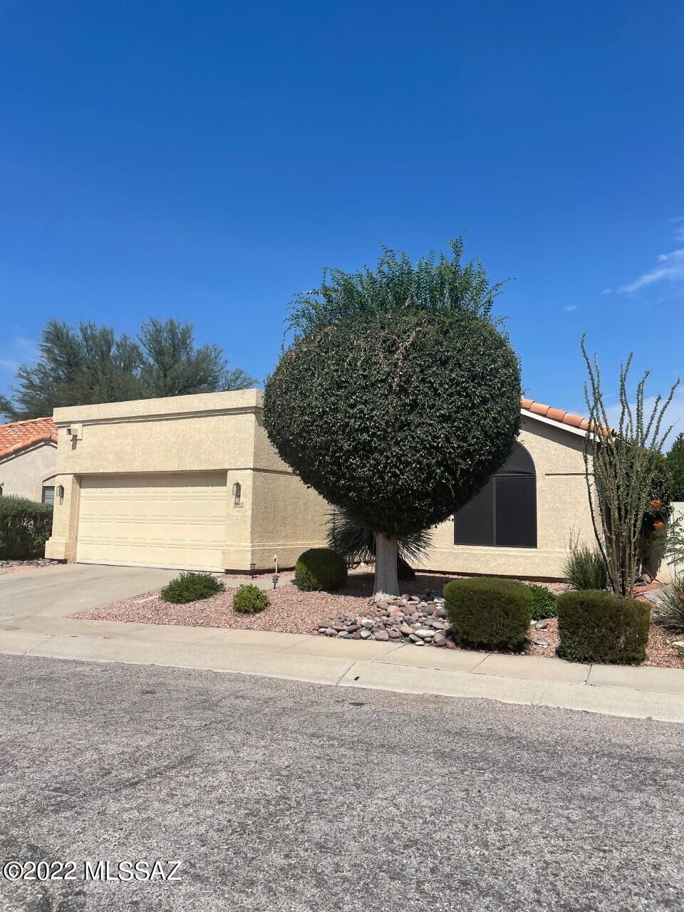 Beautiful 3 bedroom 2 bath 1653 SQFT home, The Rillito Wash, has excellent mountain views, covered patio,
 water feature and mature landscaping. Front entrance has a beautiful custom wrought iron security gate. Large owner suite with walk-in
 closet, all bedrooms have ceiling fans. Living room has a gas fireplace,
 the kitchen eat-in area opens to the covered patio and mountain views. 
 The 2 car garage has room for a work bench. New roof Oct. 2022.