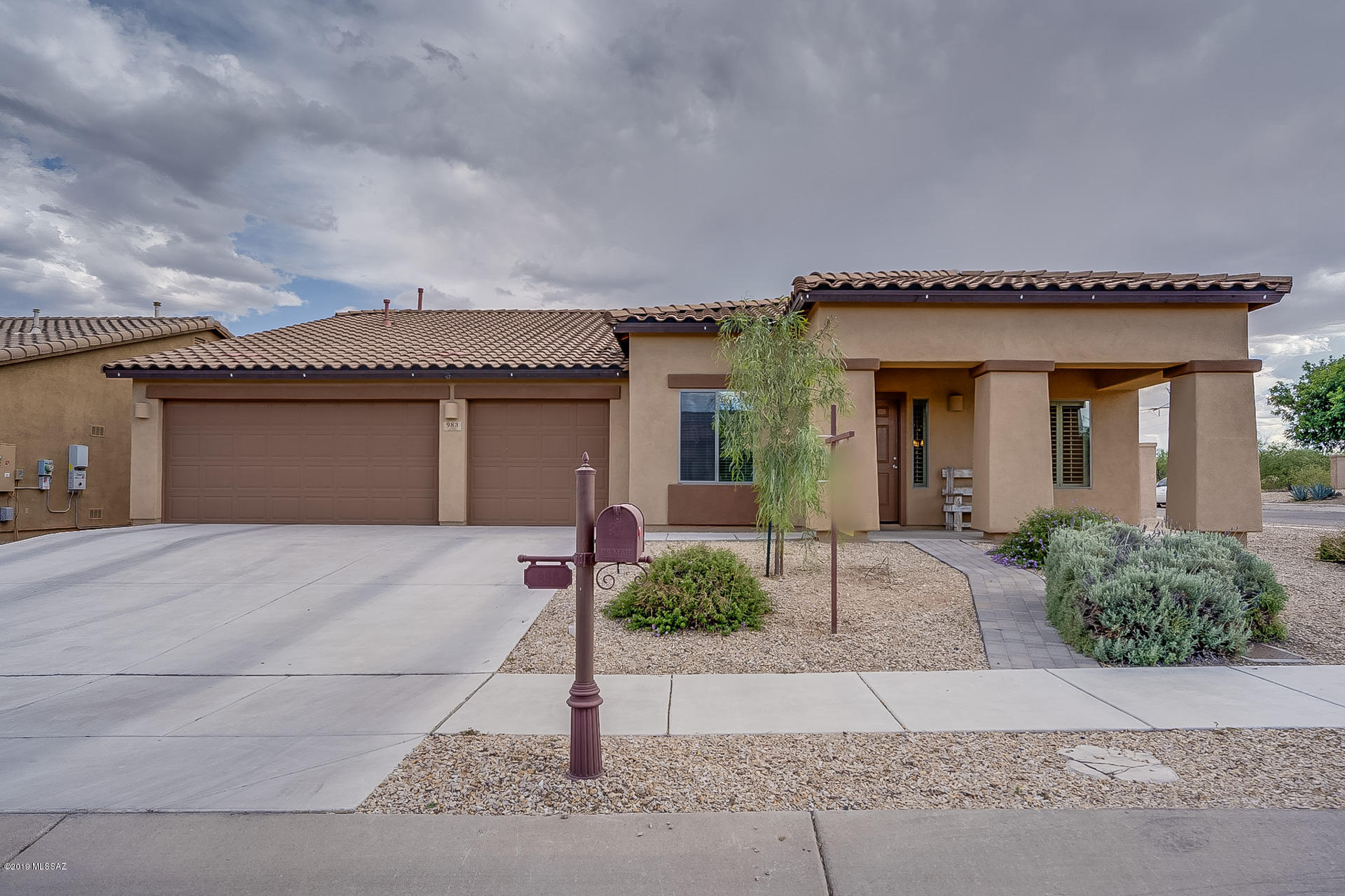 Single Story Home Situated on a Private Corner Lot In The Community of Rancho Sahuarita.  This fabulous Great Room Floor Plan offers 4 Bedrooms                                (Split Bedroom Plan), 2 Bathrooms, 3 Car Garage, Formal Living and Dining Room, Separate Office Space and an Amazing Backyard.  The Great Room and Kitchen is SPACIOUS with Ample Cabinet and Countertop Space.  Kitchen Island Breakfast Bar provides plenty of additional seating. Manicured Backyard features Covered Patio, Extensive Paver work, Fire Pit, Putting Green, Water Feature, and a Separate Dog Run.  Backyard opens to Green Space Behind for Additional Privacy . Neighbors only on One Side!