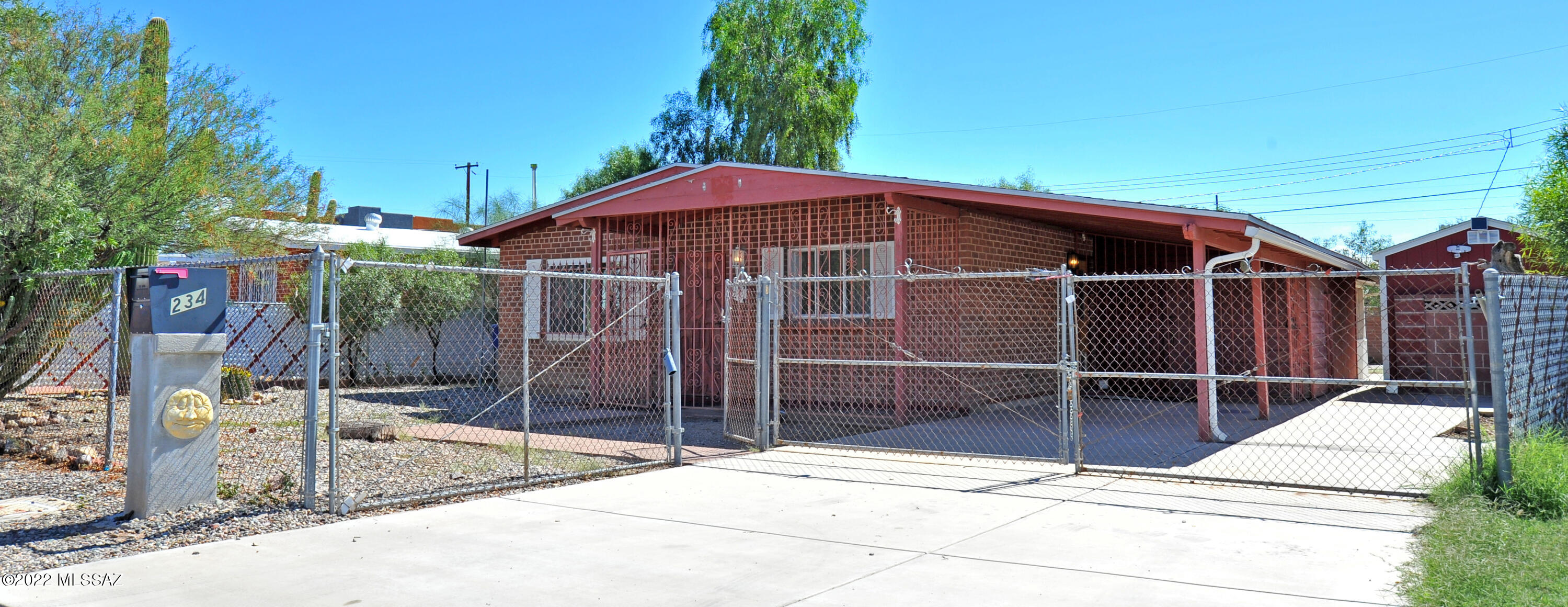 This single-story starter home is the one! Discover an interior featuring new paint tile floors in most of the house, and a spacious dining & living area filled with natural light. The kitchen offers white cabinetry and black appliances. Nice sized closets in every bedroom. Full bath complete w/new fixtures! There is an enclosed garage that can be a 4th bedroom or office if heater/cooler added to the room. This property also features a large work shop with power, 3 storage sheds & ''She Shed or Man Cave''. There is a double opening gate in the back yard to allow for a truck to enter the yard. Your new home is waiting for you. This home qualifies for up to 5k in closing costs. Ask agent for further info or see sign in front of home. Come see it now!