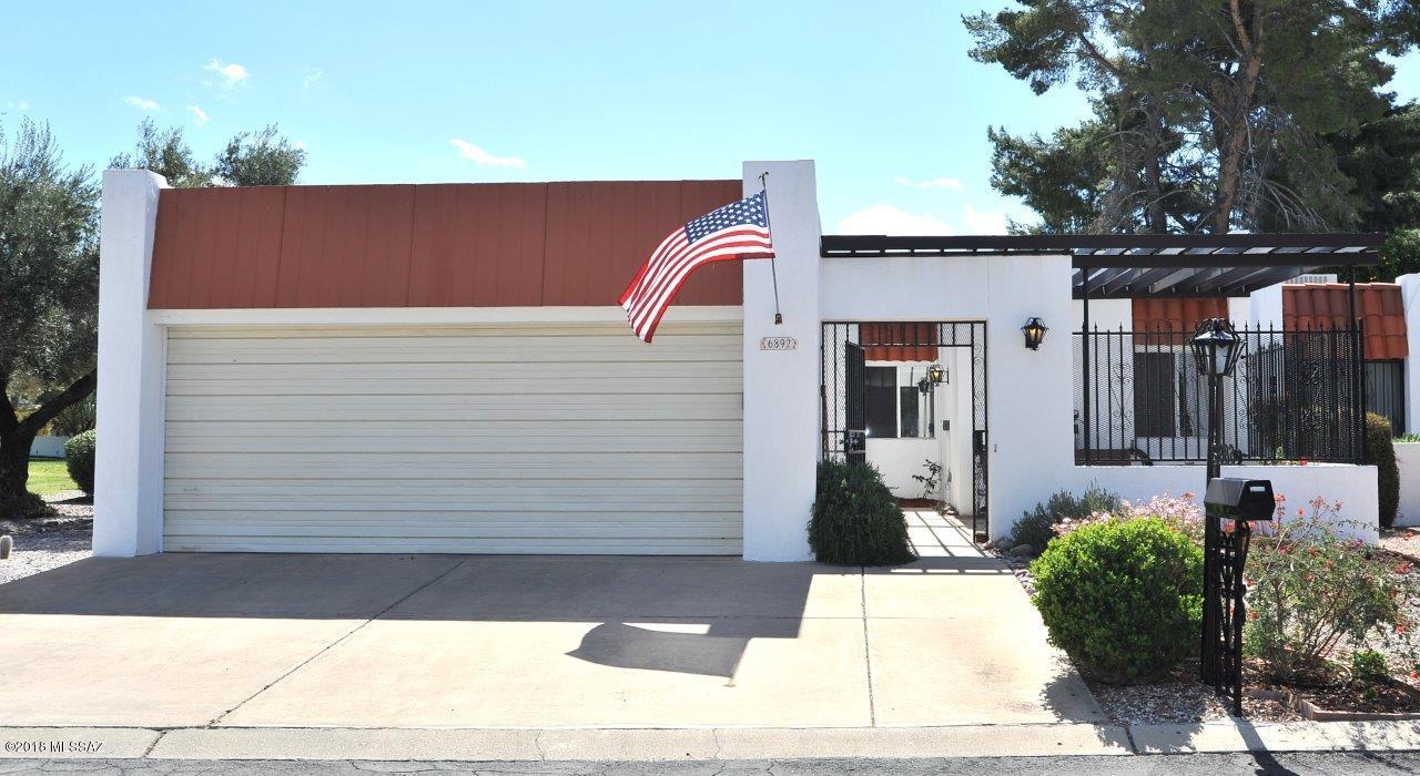 Rare opportunity to own an end unit on the golf course. Double patio doors frame the lush green fairway from the expansive living and dining ''L''.   Fireplace has a Wells Insert to bring in the fire's warmth in winter. Updated kitchen with granite counters, newer cabinets, Saltillo tile floor, convenient cooking space and separate eating area. Remodeled baths with stunning ceramic tile counters. Owner has lovingly maintained this home. Large entry foyer has newer slate flooring. Trane heat pump and newer Master Cool evap. The Arizona room is enclosed with wrought iron so pets can be safe outdoors. Also, a great place for a game of cards or dominoes. An impressive home in a great, peaceful location. A must see.