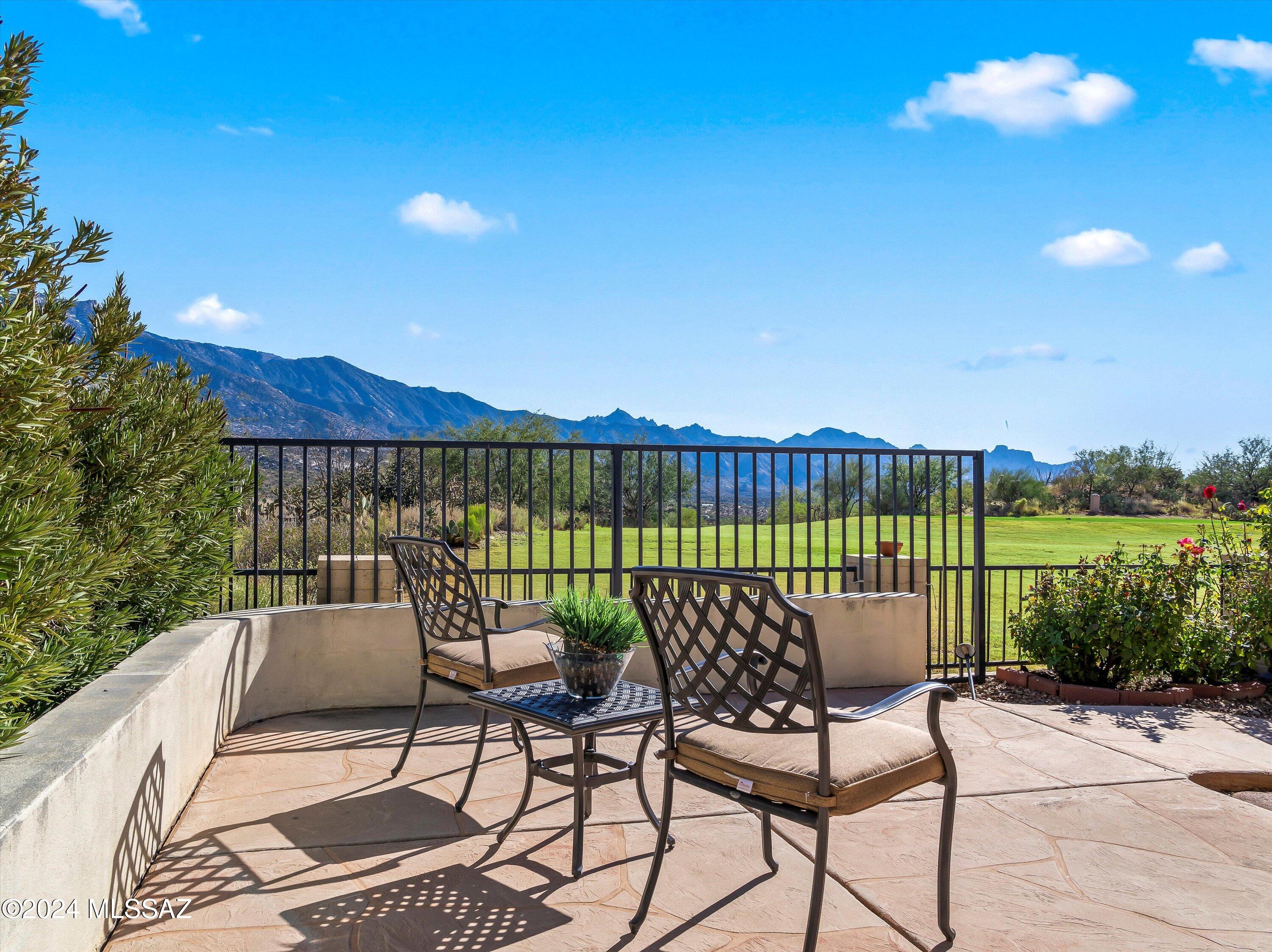 Spectacular golf and mountain views await from this Galleria model. Sited on a private golf course lot, the double door entry welcomes you into a great entertaining space for gathering and dining with warm wood look tile flooring and plantation shutters. Overlooking the beautiful views, the large family room with built-ins and a fireplace for cool SaddleBrooke evenings opens to the double island kitchen & nook and has plenty of cabinetry and counter space. Owner's retreat with plenty of room for sitting and enjoying quiet times has an updated/remodeled en-suite featuring large walk-in shower, double vanity, and two walk-in closets. The upstairs casita has two large bedrooms and bath.  A conveniently located den, powder room, loads of extra storage plus a 3 car garage completes this home. Watch the mountains turn pink while enjoying a fire in the kiva, or sitting on the extended hardscape patio watching the golf course and the mountain vistas beyond. This spacious property is made for entertaining. Come and start enjoying the unparalleled SaddleBrooke lifestyle.
