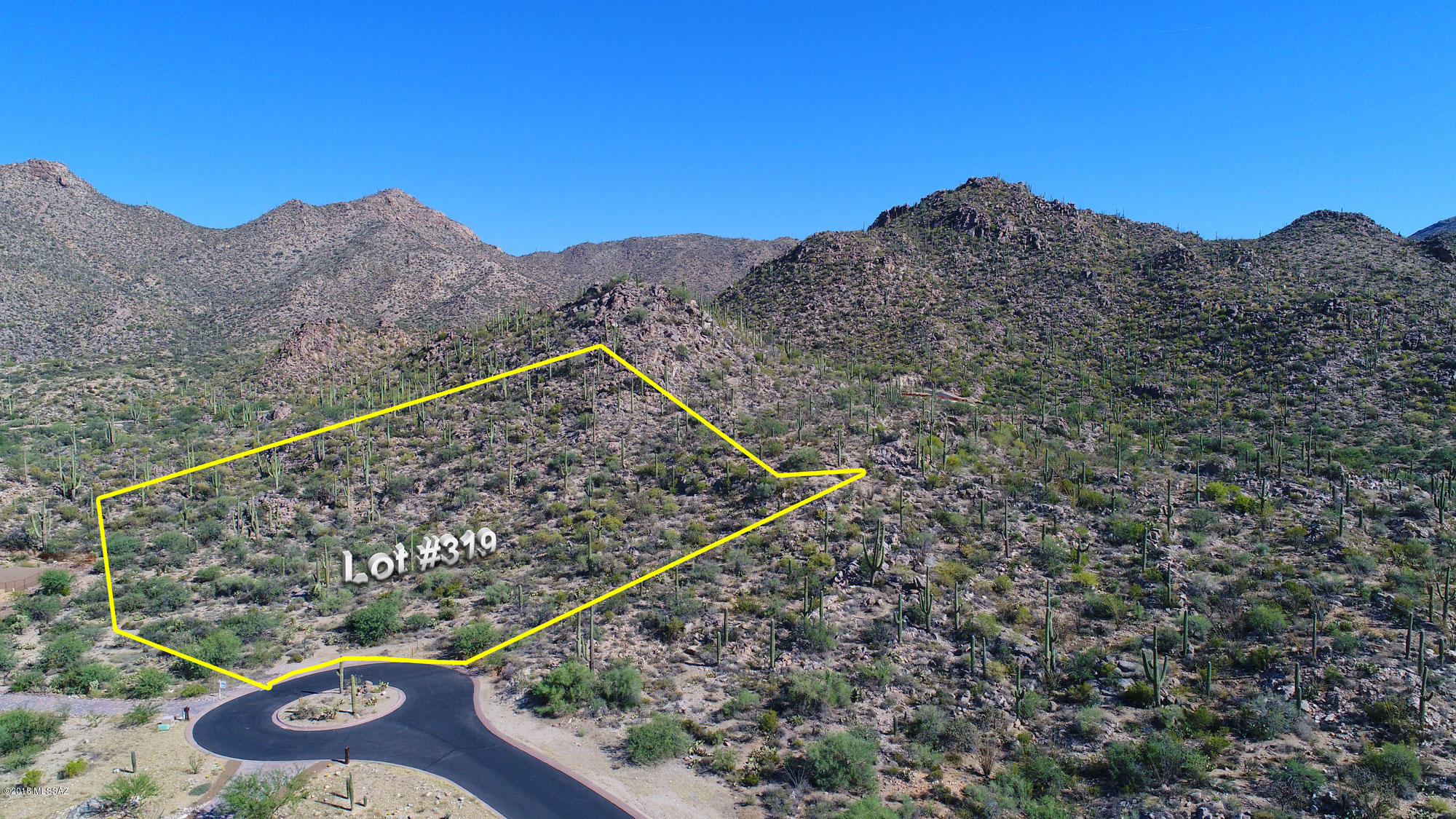 Build your dream home on this spectacular 1.61 acre lot in Canyon Pass at Dove Mountain with views in almost every direction and nicely situated at the end of a cul-de-sac.   Large, flat building envelope and the drive already cut in makes this an easy build.   Surrounded  by wonderful rock formations, lush desert and studded with gorgeous saguaros. Close to spectacular golf courses at The Gallery and Ritz Carlton.
