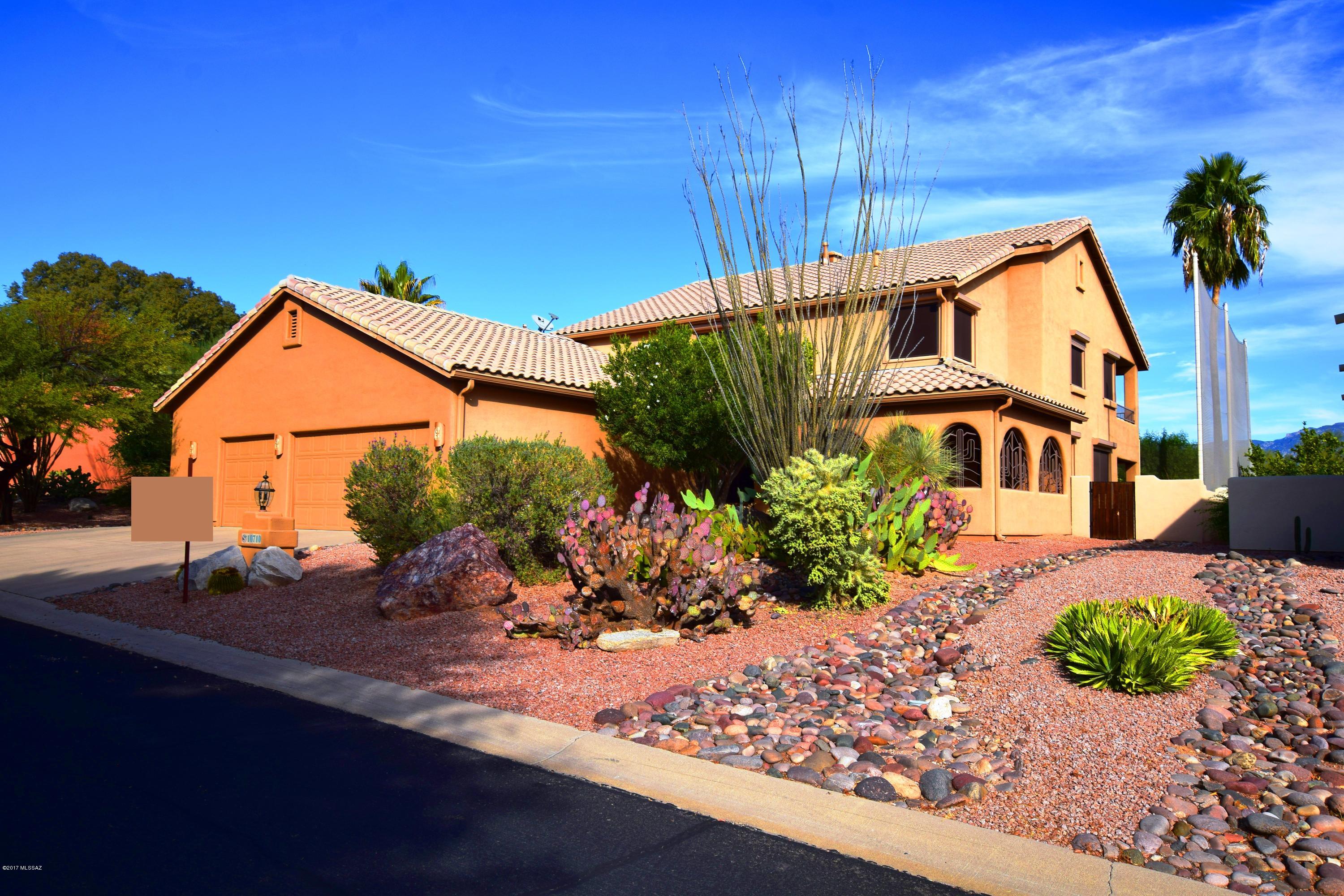 Welcome to YOUR new home within the sought after Canada Hills Community! This family oriented home is steps from the Oro Valley Community Center & overlooks 18th hole. Mountain Views! Large covered patio 0.22 acre lot. All flooring on 1st floor NEW! 
Home has just been professionally staged!
Entire home wired for network. Stainless steel appliances stay. Solar screens were removed and stored in garage. Interior freshly painted in neutral color. 2014 Daikin high efficiency A/C. Poly pipes replaced with copper pipes at time of purchase in 2005. Oversized garage with shelving and work station. Master bath remodeled in 2006 with travetine shower and flooring. Upstairs hall bath also remodeled in 2006. Bedroom 2 & 3 have double doors on them.  
Bedroom 4 overlooks golf course and has direct access to upper covered deck.