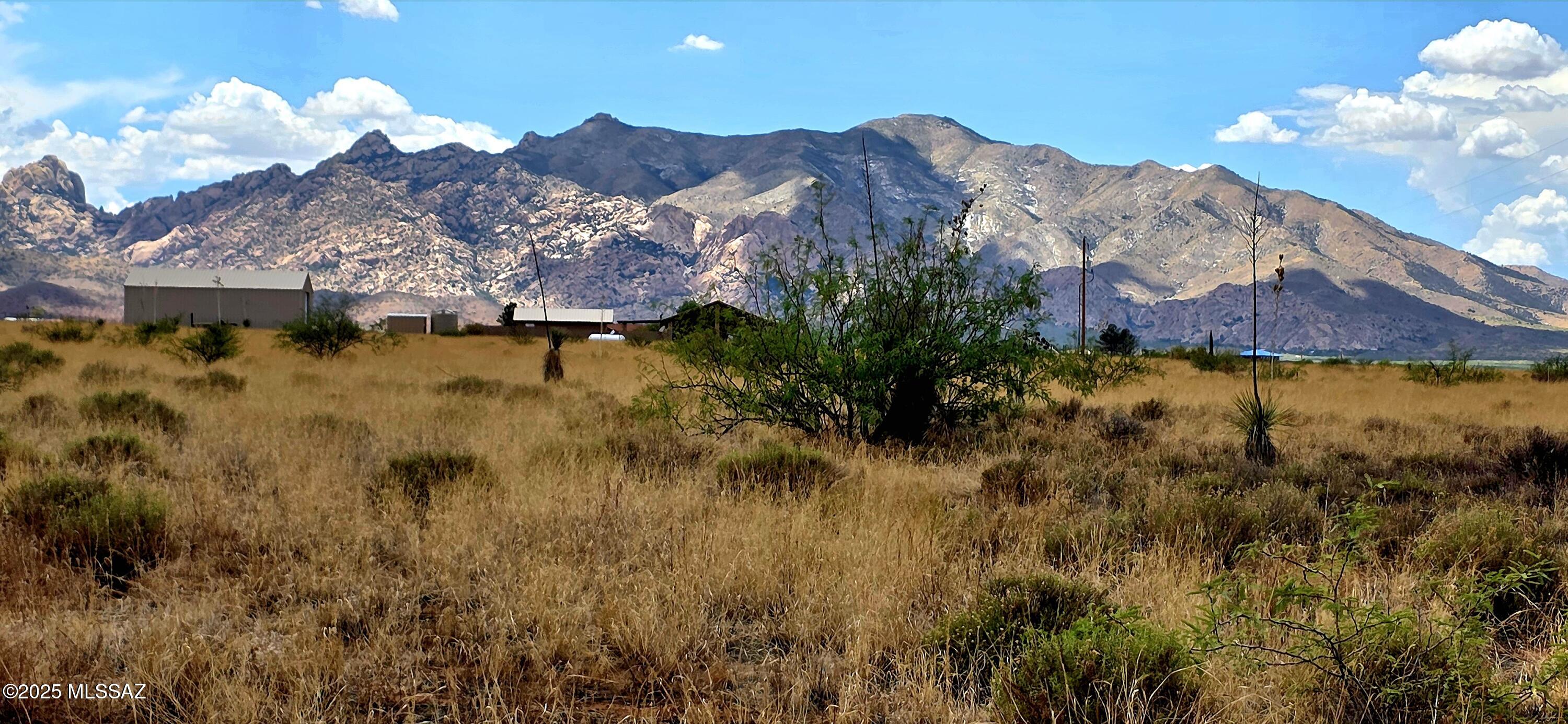 .83 acres in a quiet, rural residential neighborhood. A corner lot, the land is level and the mountain views are spectacular! Electric is at the property line. If more land is desired the contiguous parcel #116-11-166, 0827 acres is also for sale. Perfect for your site built home. Buyer to verify all facts and figures