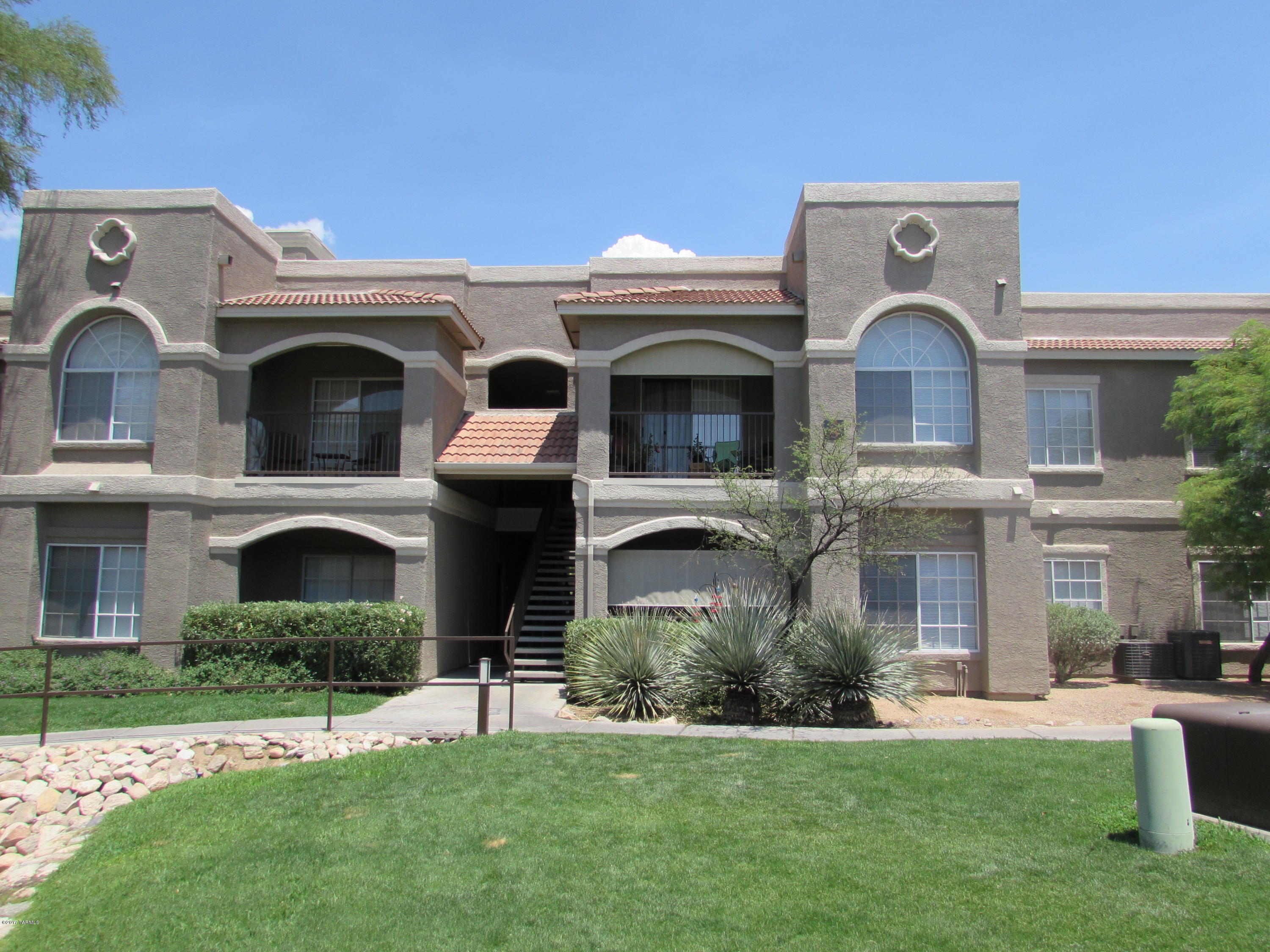 Move-in ready upstairs unit in desirable “The Boulders” condo community in the heart of Oro Valley. Upgrades to unit include updated kitchen, bathroom w/tile enclosure &  stainless steel appliances. Condo features family room w/fireplace, dining area, 2 bedrooms, 1 full bathroom.  Kitchen is upgraded w/tile counter tops, plenty of cabinet space & appliances stay!  Community amenities include heated pool & spa with sparkling fountain, fitness center, business center & much more! This is Resort Style Living at it's Finest! Perfect for Year-Round Living, Vacations or as a Rental! Surrounded by Great Hiking Trails, Shopping, Dining and Entertainment