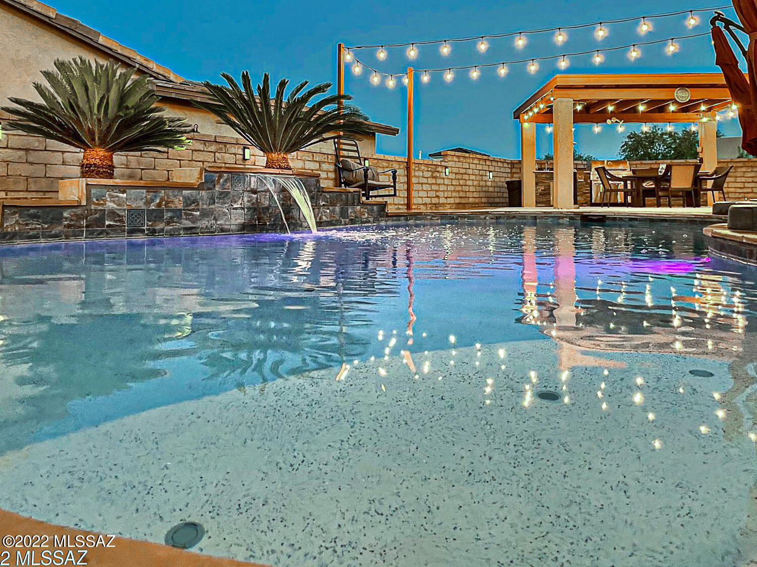 STUNNING CUSTOM BUILT ON CORNER LOT WITH RV GARAGE AND POOL AT THE ESTATES OF LA CANADA. This 2990 sq ft PRISTINE HOME has been TASTEFULLY UPGRADED and boasts 2 master suites, 2 additional bedrooms, 3 full bathrooms and an Oasis backyard that shows style and quality throughout. Enter through the inviting front courtyard with Cantera Stone fountain into the formal living room with modern gas stacked stone fireplace and formal dining room that are perfect for entertaining. Gorgeously appointed kitchen with new Quartzite counters, antique white cabinetry, stylish backsplash, New Stainless steel appliances, double oven, island, breakfast bar and breakfast nook. Spacious Family room off kitchen. The Owner's retreat offers his and hers walk-in closets and a fully remodeled master bath with new Quartz counters, new sinks, new Spa-like tile shower with rainfall dual shower heads and glass door. 2 Additional bathrooms also fully remodeled with Quartz counters and modern tile showers. Enjoy a relaxed way of living in the fantastic backyard with Pebble Sheen pool with solar heater and multicolor pool light. Ramada with outdoor kitchen, wood fireplace and extended porch. New Bosch HP3 HVAC units (2021), new Tankless water heater (2021), Owned Solar panels that cover the electricity usage. Enviro 3 stage water system, Tile and laminate wood flooring. 35 ft RV Garage, with 30 Amp hook up service and 20 x 20 ft door. Fresh exterior paint, new Intelliflo variable pool pump and new pool salt system plus a lot more upgrades. Lot size is 0.28 Acre. All around one of the best homes you can find in Sahuarita!