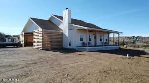 REDUCED USDA FINANCING ELIGIBLE ZERO DOWN!! Stunning newly built home on 0.64 acres offering upgrades throughout and breathtaking views.Featuring 2 spacious bedrooms and 2 bathrooms this home is designed for comfort and privacy.Highlights include knotty alder doors, birch butcher block counters, 1x6 natural pine ceilings, solar charging setup, privacy and wind barrier for outdoor comfort,tankless water heater. The open airy layout spans 1,594 sq. ft. in addition to a 545 sq. ft. garage 304 sq. ft. porch and 518 sq. ft. patio ideal for outdoor living.With RV hookups,grilling area,energy-efficient climate control and ample storage this home combines modern and farmhouse styles perfect for relaxing or entertaining.Enjoy Luxury Vinyl Plank flooring throughout! All four seasons mildy!