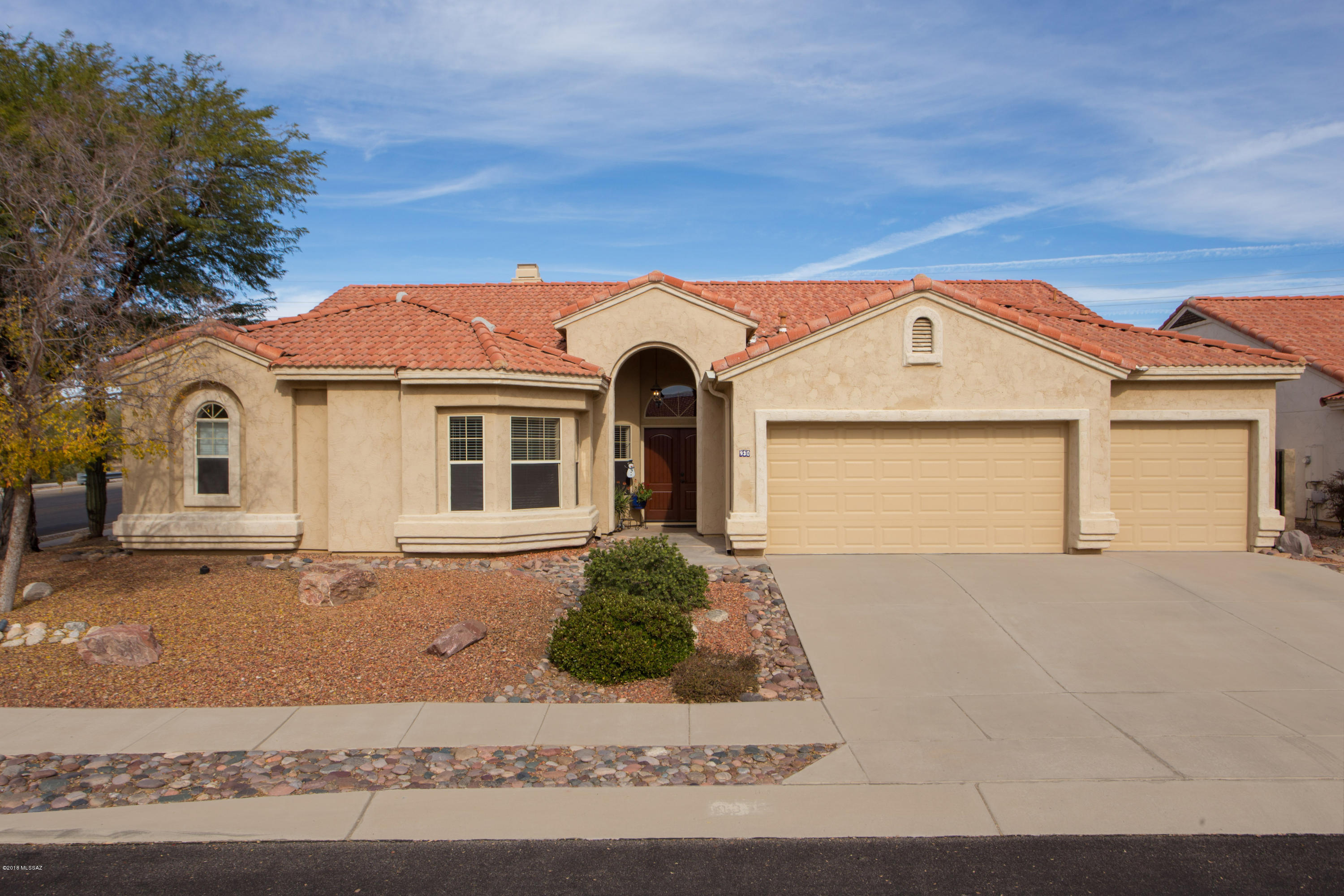 Original Owners! When they built the house they extended the ceilings approx. to ft in the entry, living room.Located in the desired Copper Creek & in the heart of Oro Valley. This beautiful 4 bedroom 3 bath split floor plan is 2418 sq ft w/3 car garage and pool. The home is open, bright & inviting. The spacious kitchen with a cozy fireplace for those chilly nights has a large island and ample cabinet storage. If you love to bake or cook, this kitchen is for you. The living room overlooks the lush backyard and outdoor living area, which allows you to move your living experience outdoors. The home also features a formal dining area & living room. Large master suite w/walk-in closet. The backyard has mature trees including Naval Orange, Grapefruit and Lemon trees! Does Not get Any Better The HVAC units are 4 years old , The house has had all poly piping replaced in 2016. The Pool is a Play Pool starting with 3.5 feet to 6 ft. center to 4 ft. Many days were spent splashing around and playing games with the kids.
Priced to sell......