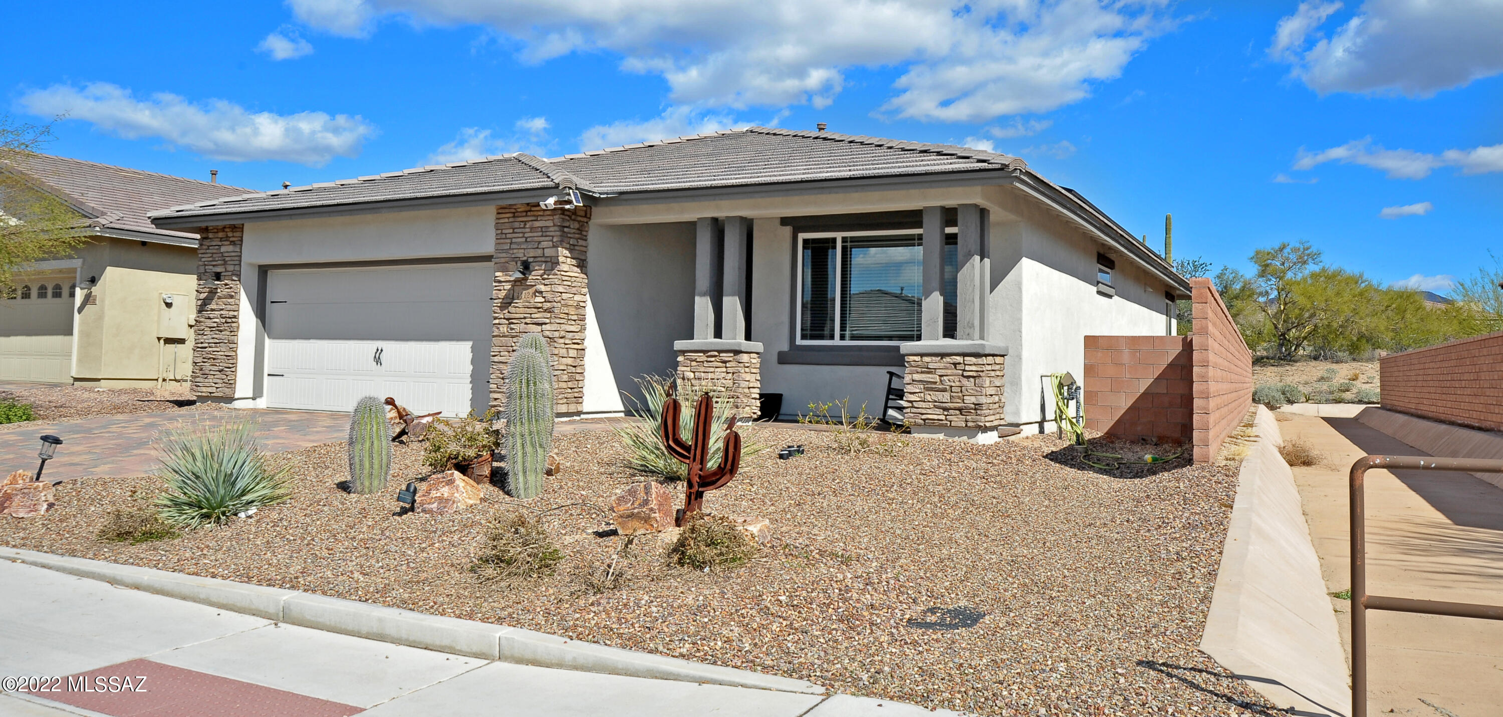 Blue Agave at Dove Mountain. Like new highly upgraded 3 yr old home with spacious great room! Gourmet kitchen has staggered maple cabinets,granite counters,5-burner gas cooktop, wall oven/micro combo,tiled backsplash & walk-in pantry. Primary ensuite has a large walk-in closet with access to laundry rm,dual sinks with granite countertops  & walk-in shower. Upgrades include: Coffered ceiling in Foyer & Master Suite, 8' interior doors thru out, recessed lighting in great rm & primary bedroom,two-tone paint, gas for BBQ ,ceiling fans.  Owned solar system makes electric bills very low.  Aqua Pure whole house water system. To help with allergies the HVAC has a Lennox UV light air filter that removes 99.9% of contaminates.  Electric vehicle charging station included!  Perfect second home!