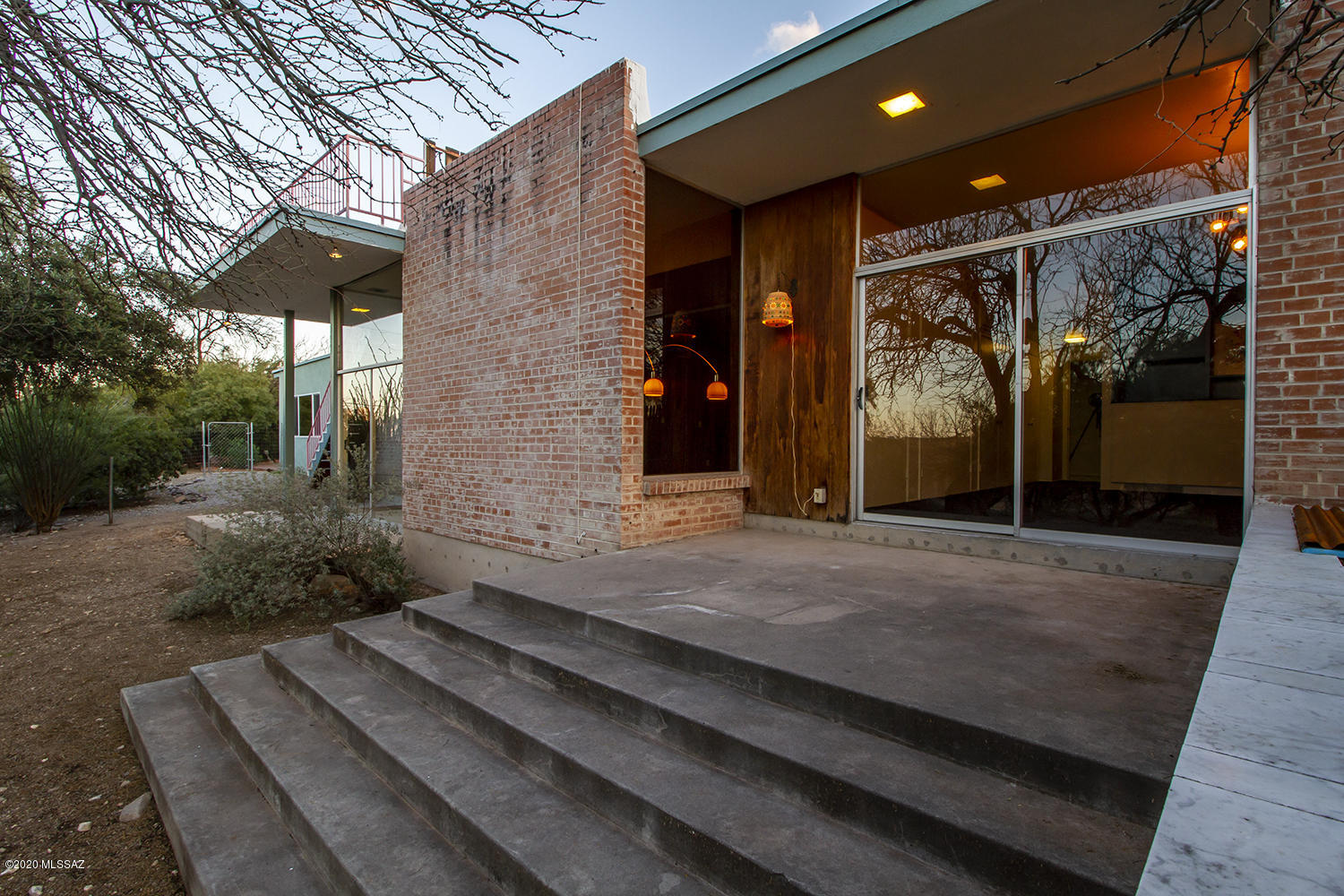 The iconic mid-century neighborhood of Painted Hills was developed by S.I. Schoor in the 60's. This was the first and finest home, built for Schoor and his family, and designed by architect David Swanson in 1966.  Schoor had much input and  happily recalls putting in the redwood paneling in the sunken living room with high beamed ceilings and huge glass door/windows.  His home was built on the lay of the land with higher ceilings on the very large north-side of the home (master bedroom, living/dining room, kitchen, and hearth room) with a long hallway to the south opening to his children's' bedrooms, which open to the large, private patio area. A pool was added in 2000. This home has been loved and maintained by it's three long term owners, and is largely original. See the virtual tour!
