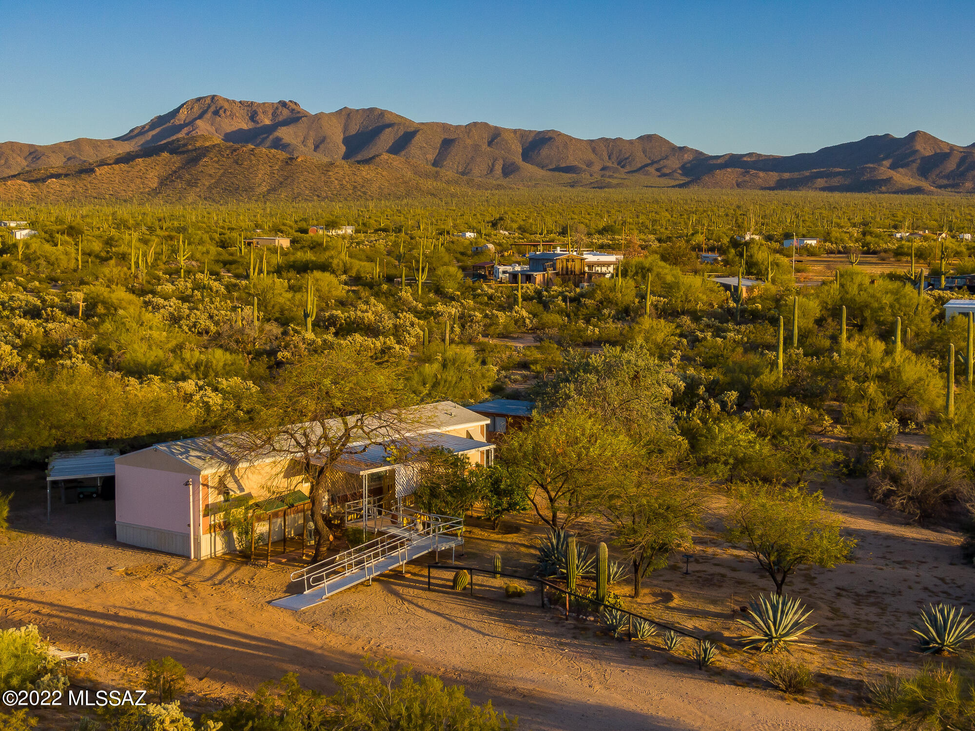 If you are looking for a home in the beautiful desert, with privacy and peace and quiet, this is it! 1999 Redman Manufactured home with recent roof and fresh paint awaits you! Situated on a generous GR-1 zoned 2.1 acre lot, this property boasts an additional space with a 2nd certified septic, electric and water service for your RV or another home,  with possibilities for income, or in-laws! Inside, this clean little charmer is ready for your upgrades and ideas, but includes 2 year old Energy Star washer and dryer, plus fridge and freezer. The heat is propane, and the buyer will have to furnish their own tank,  Cooling is with window/wall units, which kept the owners happy and cool since they purchased the place new. The home is attached but not registered as affixed. This is a must see!