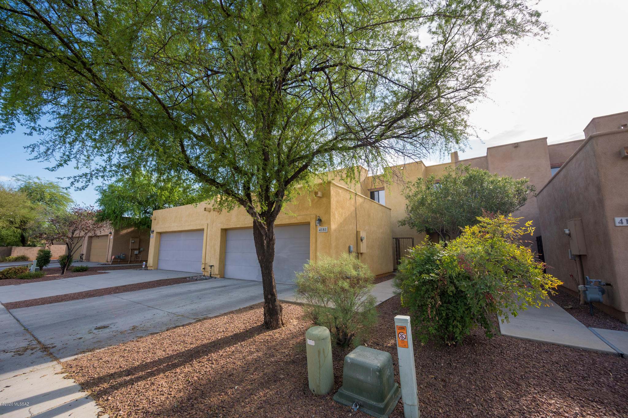Location-Location-Location !!! Centrally located to shopping centers, restaurants, River walk and short bike ride on Mountain Ave bike path to the University of Az. Well maintained split floor plan with Master Bedroom and Bathroom on 1st floor. Two additional bedrooms and bathroom located on 2nd floor. Upgraded maple cabinets with Corian counter tops, ceramic flooring through out first floor and new laminate flooring at staircase and 2nd floor. A must see !