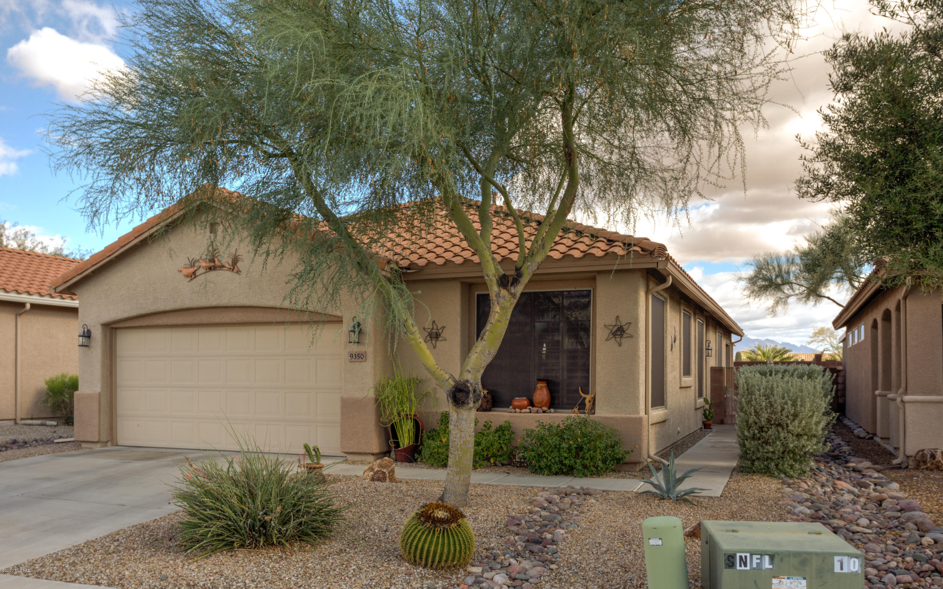 This updated Santa Rita model ranch in the 55+ Community of Sunflower has the amenities you will enjoy.  Spacious Great Room with plant shelf & cathedral ceiling leads into the accommodating Dining Room area. Proceed into the Kitchen with its Corian Counter tops (replaced in 2018), breakfast bar, pantry & eat-in breakfast area with views of the mountains. The laundry area is right off the Kitchen. Guest Wing hosts a Guest Room w/ Walk-In closet, Guest Bath along with a separate Den/Office. Master Bedroom has a vaulted ceiling with a large Walk-In closet. Master Bath hosts dual vanity sinks, garden tub & separate shower. HWH in 2017, HVAC in 2018 and half of roof replaced in 2018. The lovely back yard with spacious patio will give you hours of relaxation enjoying the mountain vistas.
