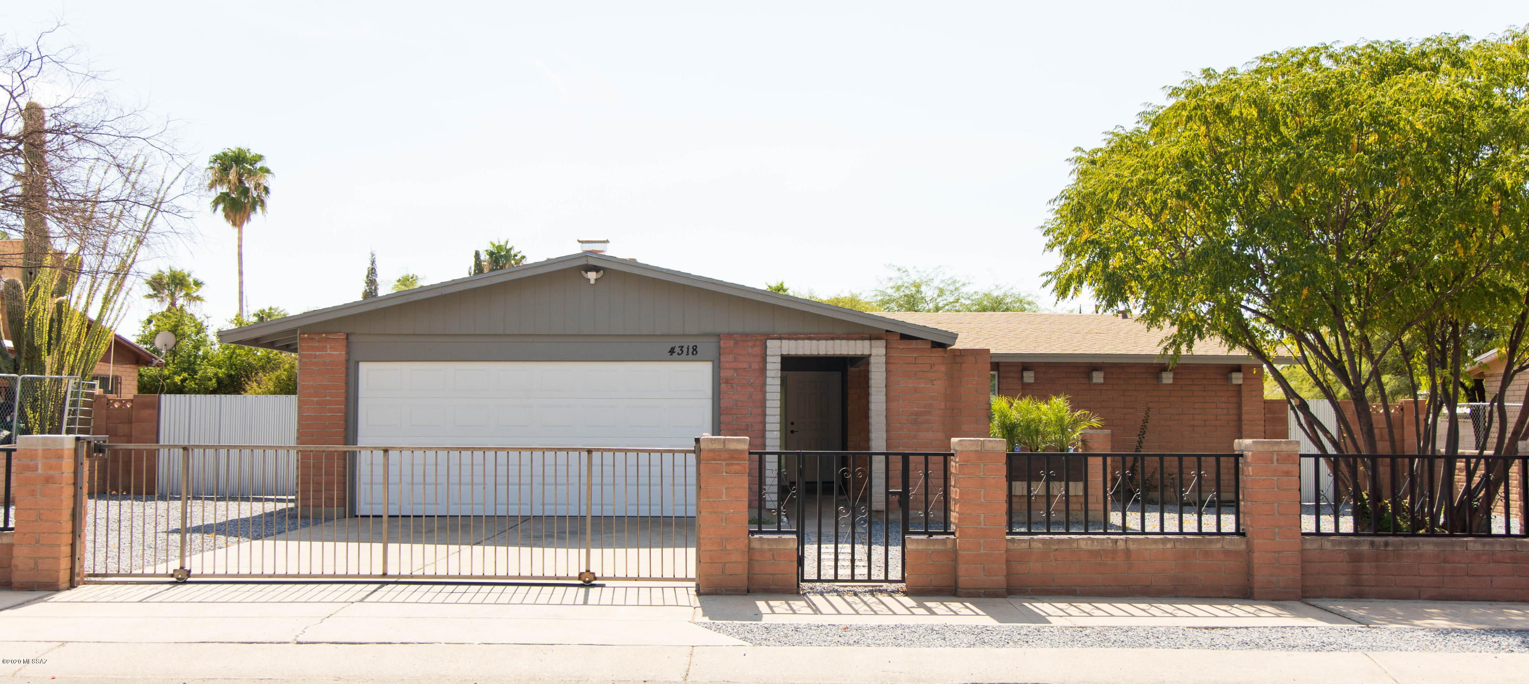 Come see this beautifully updated 3 bed, 2 bath home with newly remodeled pool! This house has it all! The formal living area flows into the dining area & remodeled, modern kitchen with a single basin stainless sink, single handle pull down faucet, white cabinets, with quartz on the breakfast bar, & stainless steel appliances. Perfect for the chef in the family! The separate family room has as it focal point the fire place has modern Italian tile from floor to celling & ceramic tiles on the hearth-stunning! New dual pane windows throughout with new white blinds. Flooring throughout is 18'' ceramic tiles. The private block wall enclosed back yard is divided in 2 areas- the newly resurfaced pool with new tile & decking & second large play area. Nice covered patio for entertaining. The pool area has new wrought iron fencing.  The exterior of the home was recently painted. The back exterior wall of the home and northeast exterior wall was recently stuccoed and painted. The front yard is enclosed with a block wall with decorative wrought iron.  Brand new custom sliding gate for the driveway.  New metal 2- panel swing gate so you can store your toys in the back yard.  See attached features sheet.
