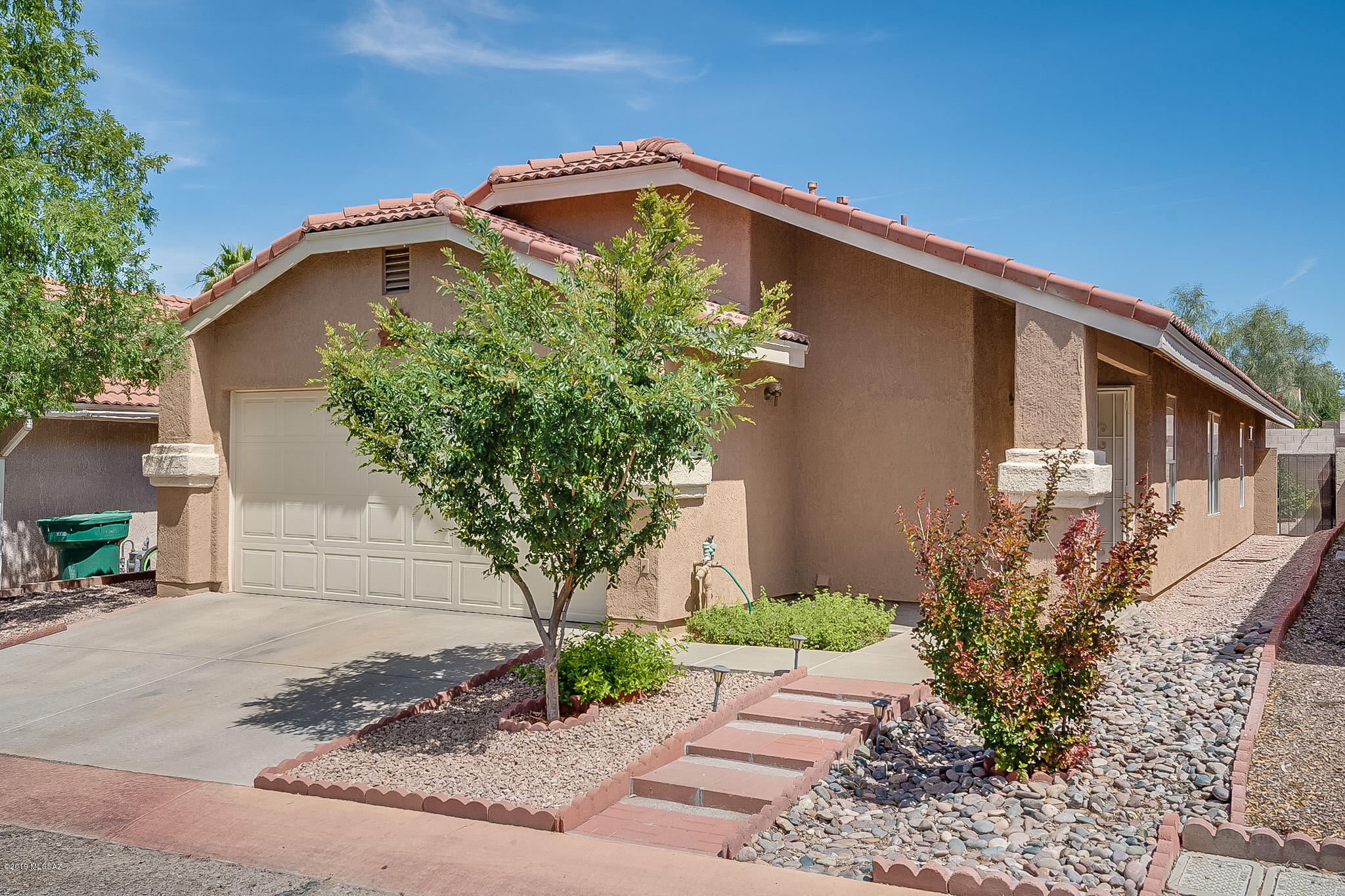 Move-In Ready home.  This gorgeously maintained 3 bd/2ba home offers a bright and open floor plan with large living room/dining area, and separate family room.  The home is tastefully decorated in neutral tones that are sure to go with any furniture.  The kitchen has been updated with style stone counters and stainless steel appliances.  Each bathroom has also been updated with newer vanities with granite counter.  The backyard is fully landscaped with large tree for shade, rose bushes and other smaller shrubs.  This community offers a community pool.  Property is located close to dining and shopping.
