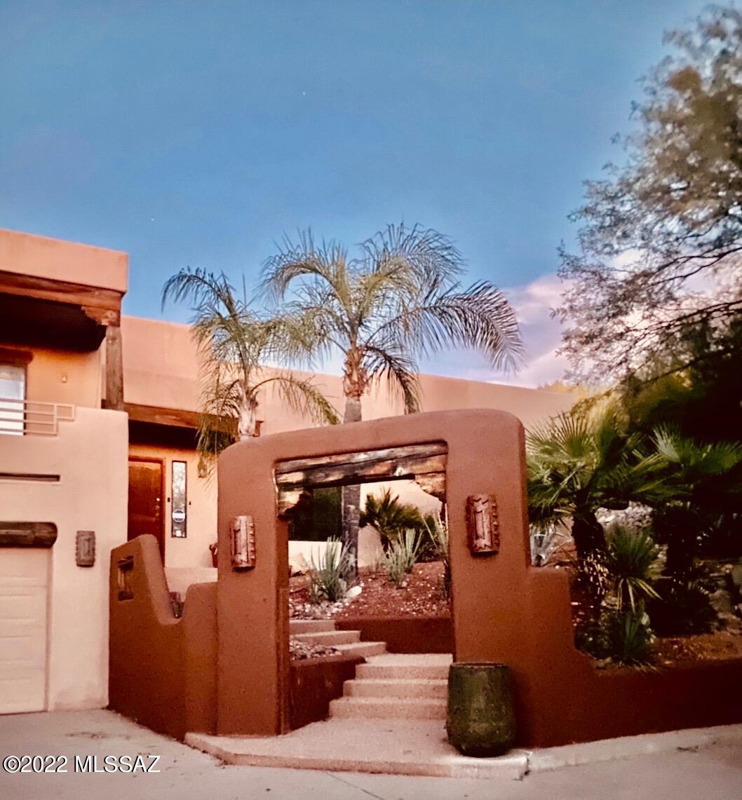 Great opportunity to live in one of the best areas of Tucson, the Catalina Foothills. This gorgeous split-level boasts fantastic views of the city, Arizona sunsets, and a backyard desert oasis with picturesque Sedona red rocks. Privacy galore in a resort style home with a brand-new pebble-tec, 2021, pool  with the backyard hillside as a backdrop.
The master bedroom opens onto a jacuzzi and a private patio to cross over a Japanese redwood bridge for a retreat to a private hammock reading nook. The fun backyard with a large, covered patio is perfect for entertainment and the multiple level seating areas provide unique places to unwind and enjoy the desert wildlife. The master bedroom... features exquisite views everywhere with a picture window alcove tub to soak and relax in, a large walk-through shower, and a great walk-in closet. The large bedrooms are private from the main living area. 
Once inside walk into a dazzling beamed foyer that opens up to an 18 foot high ceiling great room with large picture windows, a private formal dining room, a cozy breakfast nook, and brand new concrete flooring...all overlooking the unbelievable fabulous backyard. The newly redecorated kitchen has lovely new kitchen cabinets, refrigerator, and beautiful granite countertops. 
Another large family room is perfect for TV viewing, pool, exercising, or a large office with a private balcony.  
It's a perfect home for enjoying life!

Close to some of the finest schools in Tucson: 
Basis Tucson North, The Gregory School, and open enrollment for district 16. Whole Foods, a public library, and fine restaurants and shopping are a few blocks away. Some of the Tucson's superb golf courses and gourmet restaurants are in short proximity.
Furnishings available on a separate Bill of Sale.
This property is being sold AS-IS. Water Heater, refrigerator new in 2021. Spa pump new 2022