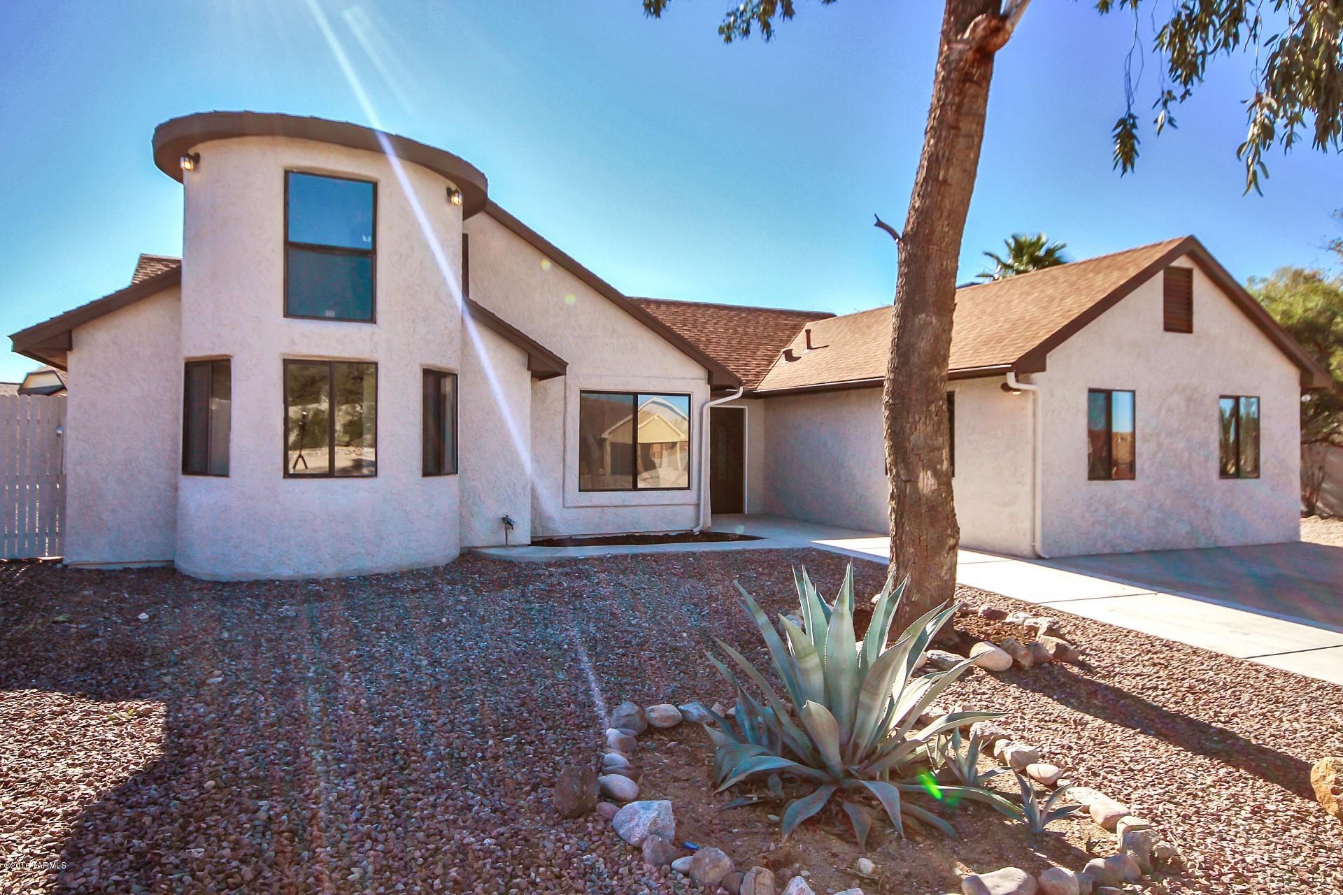 Completely renovated 4bd /2ba home is located on a large, private corner lot w/new fencing & landscaping. Home boasts large living areas w/high ceilings, new flooring, new paint inside & out, new lighting fixtures, new piping & plumbing throughout, & much more! Totally new kitchen features beautiful cabinets, stainless steel appliances, granite & seating area. Designer touches include stacked-stone fireplace, gorgeous wood plank ceramic tile & high-end granite. Huge master suite w/beautiful new bathroom. Both bathrooms feature granite countertops, nice fixtures & lovely tile surrounds. Kids will love the one-of-a-kind loft! Brand new AC/heating unit & updated roof; both have transferable warranties. Don’t miss out on this fantastic opportunity!