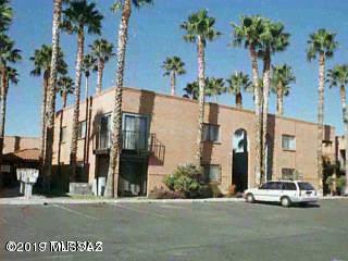 IDEAL INVESTMENT PROPERTY.  Tenant leased through March 2020 with tenant willing to renew for 2 years! Lower level two bedroom, one bath condo with enclosed back patio. Ceramic and carpet flooring, refrigerator & stack-able washer/dryer included. Wrought iron security bars throughout the home for added security. Newer A/C. Close to the University of Arizona, shopping mall, theaters public transportation, city parks, zoo & many great restaurants. The Homeowners Association (HOA) of $160 monthly covers water, roofs, pool and common area maintenance.