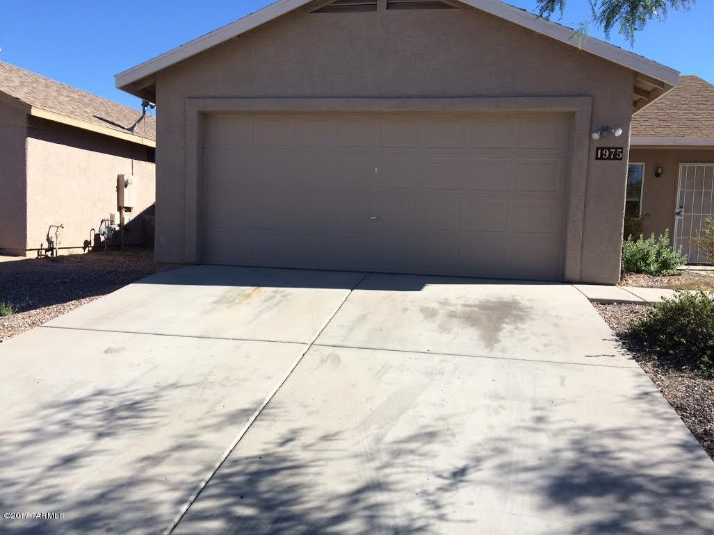 Great home with tile throughout! Refrigerator, oven/stove (electric) dishwasher/disposal included. Laundry closet with hook-ups(electric) in kitchen. Eat in kitchen with sliding door to back yard (block wall fenced). Master has large walk-in closet and en-suite full bath! Two other bedrooms plus hall full bath.  Central A/C, forced air gas heat. 2 car garage. This is a non-smoking house. Pets allowed with owner's approval and pet deposit. No more than 2 medium sized dogs please. Tenant responsible for ALL utilities.