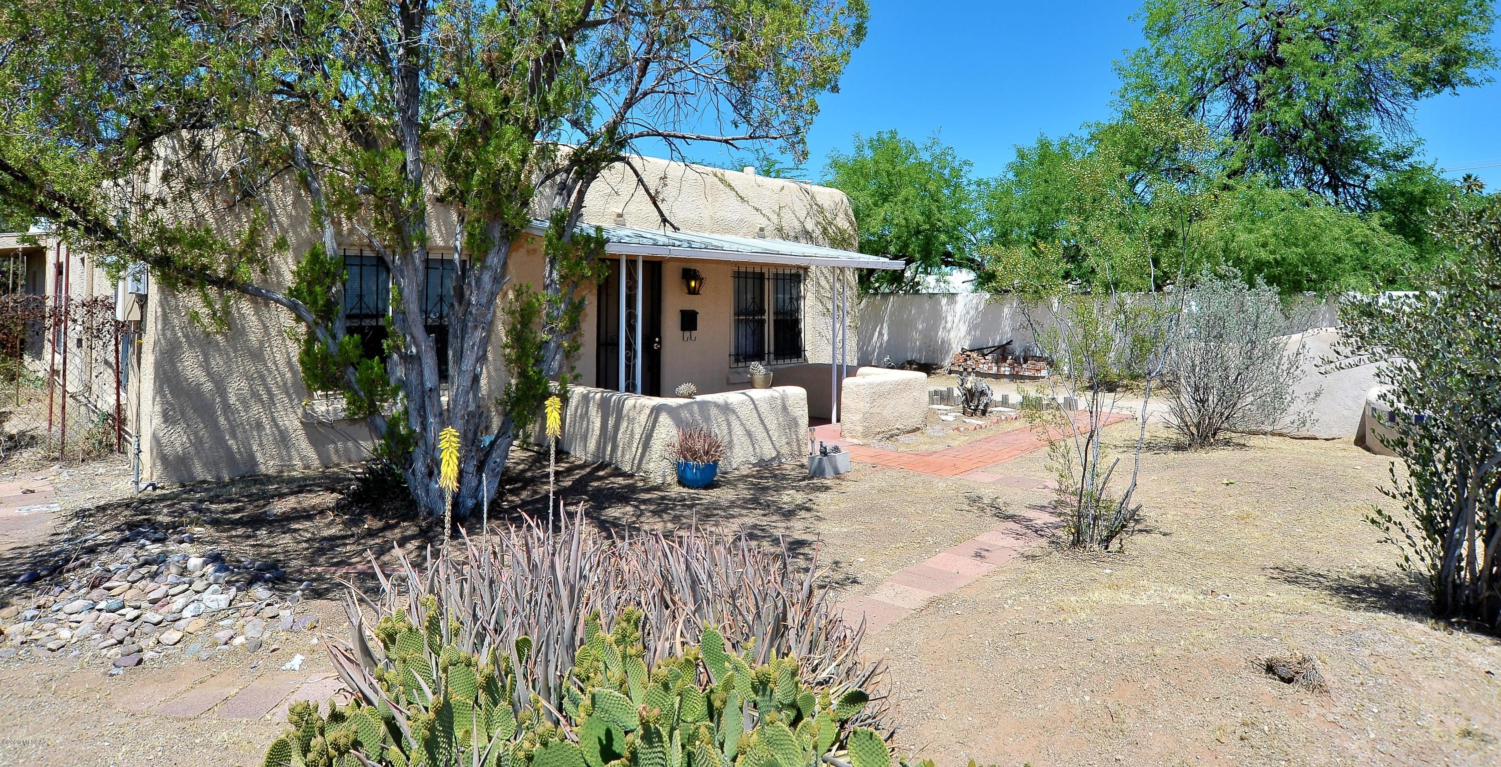 Great investment or 1st time home buyer opportunity.  Clean and bright, move-in ready. Convenient Central location, ceramic tile throughout (no carpet). Workshop in garage has laundry room with washer and dryer.  Large enclosed back yard. 
 waiting for you to transform into a private oasis. Close to shopping, transportation, etc.