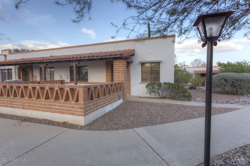 Great Location! End unit, with view of grass circle. Front parking. Interior newly painted throughout. New carpet in living room and bedrooms. All furnishings included with separate bill of sale. This villa has Evap. Central location, nearby amenities. HOA covers all exterior, including roof, water heater, Heating & air, trash pick up and water. Great for full or part time residents.