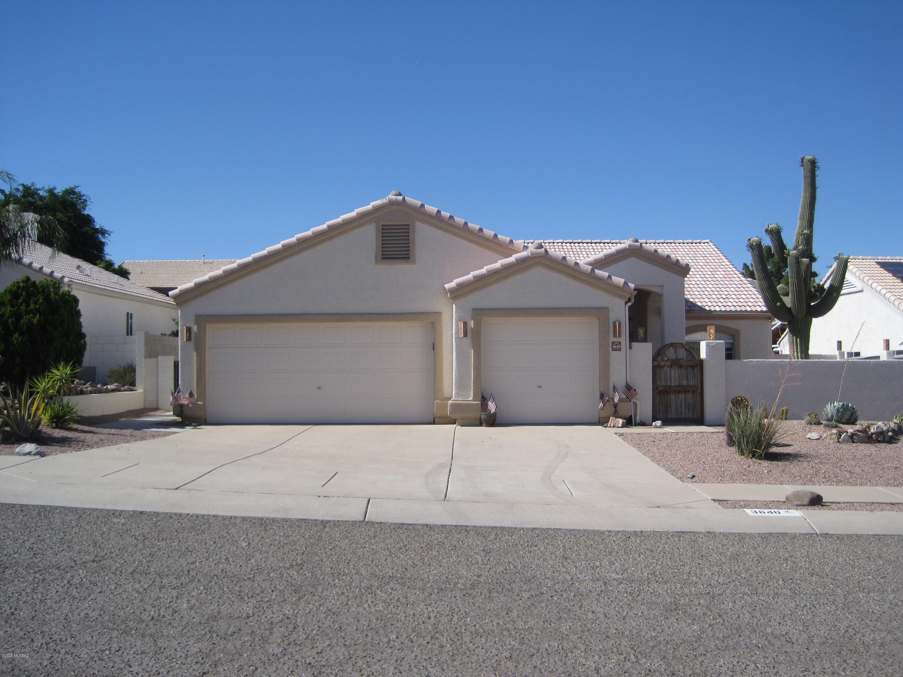 Gorgeous 4-bed, 2-bath conventional home, located within highly sought Thornydale Terrace Subdivision, with views of both mountains and sunsets. Beautiful brick paved front courtyard, and large back patio. Decorative ceramic tile layout throughout home. Both Master bedroom & kitchen have cozy bay windows. Wrap around kitchen cabinets, refrigerator, dishwasher, range, all included. Interior/exterior recently re-painted in 2019. Master bath also has a relaxing garden tub, with separate shower. Carrier A/c for comfort is the key. The front/back yards are low maintenance, with bushes, desert plantings, and decorative landscape adding a nice touch. The laundry room has a washer, dryer & added value storage cabinets. Tandem 3-car garage, with work area, and lots of extra storage cabinets.