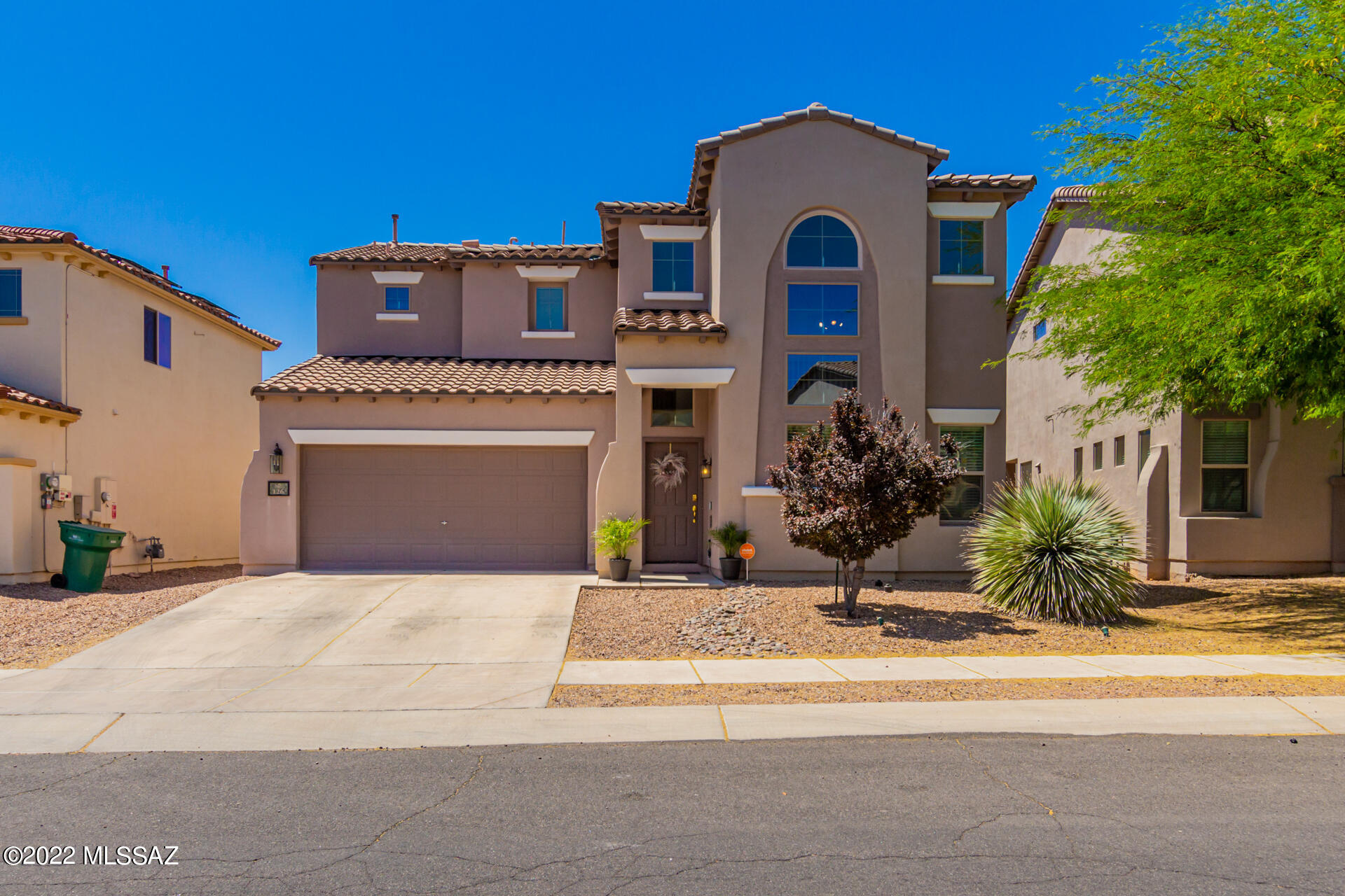 Amazing opportunity to own this beautiful two story home located in Rancho Sahuarita! This home is turn-key ready! Upon entering you are greeted with soaring ceilings, and natural lighting throughout. A soft palette, and open floor-plan is excellent for receiving guests. Formal dining room with large picture window & delightful chandelier. The pristine kitchen offers plenty of wood cabinetry, track lighting, black appliances, & breakfast bar. The sizable bedroom boasts soft carpet & an ensuite that includes a dual sink & walk-in closet. Bonus room downstairs can easily turned into an office or entertainment room! Enjoy gatherings in the spacious backyard with cozy covered patio, pavers, & synthetic turf. This community offers wonderful amenities including a pool, spa, sports courts & recreational center. So much to offer!