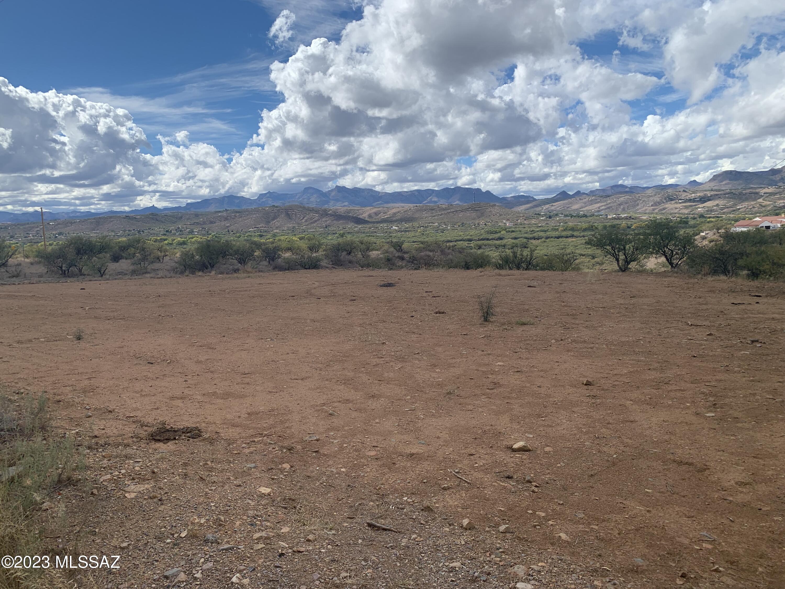 Nice .45-acre hilltop lot, flat with awesome views and ready to build your dream home. Electric and water at lot line but should be verified during inspections. Located close to the Frontage Road and Interstate 19. 1.2 miles to Mountain View Elementary School, 2.6 miles to Coatimundi Middle School and 1.5 miles to Rio Rico High School. A successful Perc test was recently completed.