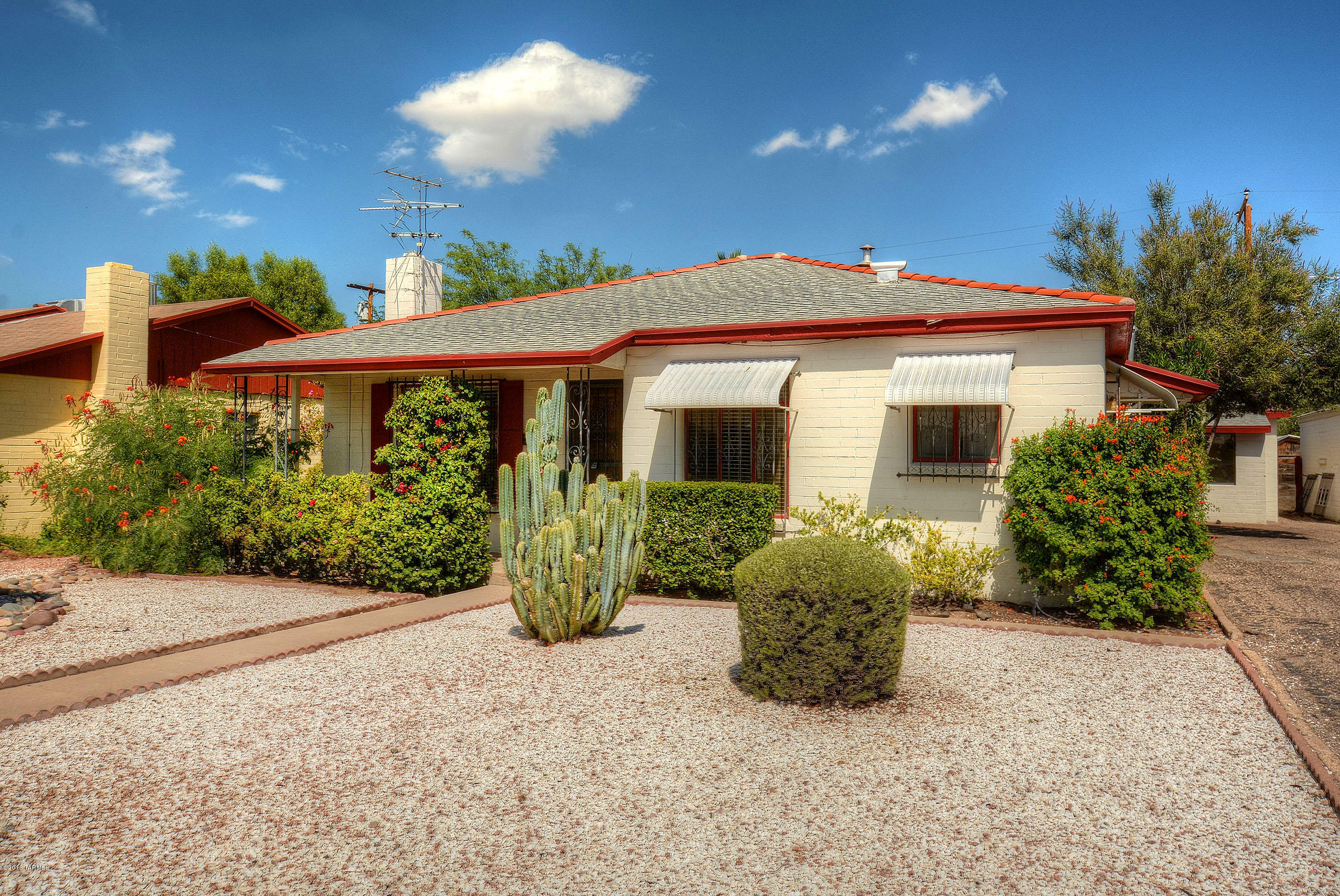 *HISTORIC GEM* CLASSIC JEWEL LOCATED IN *POET'S CORNER* BRINGS TUCSON HISTORY ALIVE! BUILT IN 1949* THIS CHARMING HOME IS IN EXCELLENT CONDITION-NEWLY REMODLED KITCHEN/BATHS! MAIN HOME OFFERS 3 BR/2BATHS & DETACHED 1BR GUEST CASITA! OVERSIZED BACKYARD HAS MATURE LANDSP, GRASSY AREA, EXTRA STORAGE SHED, CEMENT PATIOS & WONDERFUL MTN VIEWS! GREAT CURB APPEAL- FILLED W/ BEAUTFUL DESERT CACTI/FLOWERS, ENJOY SUNSETS SITTING ON YOUR FRONT PORCH!ENTER HUGE GREAT ROOM WHICH BOOSTS TIMELESS OLD CHARM ~ ORGINIAL MASONRY FP, BUILT IN BOOKCASES/DESK/CHINA CABINET DEFINITLY A KEEPSAKE! NEWER KIT HAS LIGHT MAPLE CABS, PLENTY OF COUNTERS, SS OVEN & REFI/WASHER/DRYER ALL INCL! SPACIOUS BR'S W/BUILT IN DRESSERS/SHOE RACKS/SHELVING! NEWER CARPET/TILE & HVAC! GREAT LOCATION- CLOSE TO CENTER OF TUCSON!