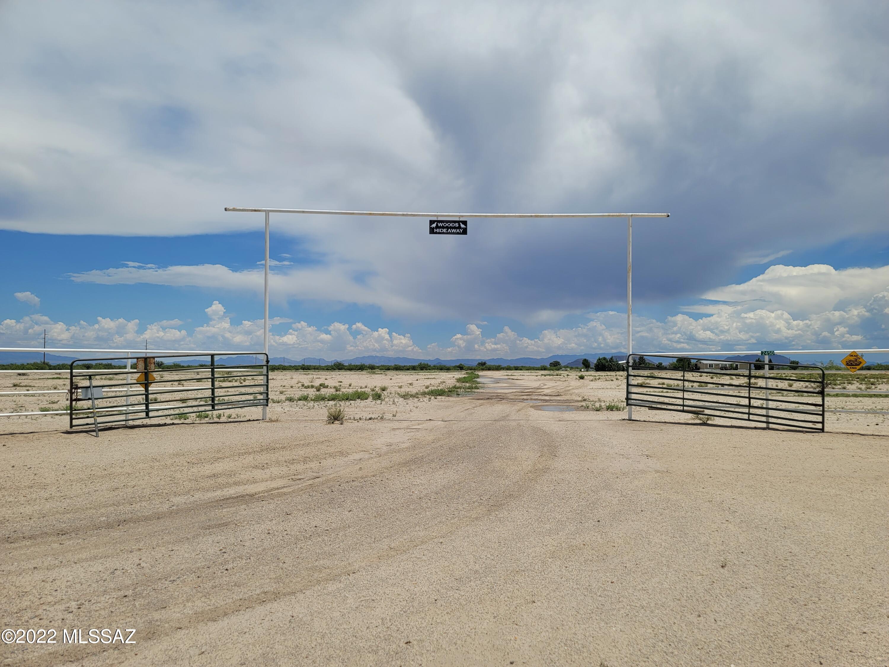 Secluded 40 Acre Ranch with Shop and Manufactured Home with Outstanding Views of the Dragoon and Chiricahua Mountains.  4 bedrooms, 2 bath home. 40'x40' Steel Workshop with Bar and Full bathroom, double insulated, 1 large roll up door, enough room for 4 cars and more room to spare. There is a Full RV Hookup with 50 AMP Electrical, Water and Septic Dump Connection. The property is completely fenced with gated entry. Room for all your Animals, Garden and Trees and SO MUCH MORE!!
Registered Irrigation Well with Domestic Pump serviced by Allen's Well Service with new pressure tanks in the past 3 years. 
This property needs some work to the AC, Front Deck and Gutters, but Property is Priced to sell.  ALL Personal Items remaining in the House/ Shop and on Property will NOT be removed.