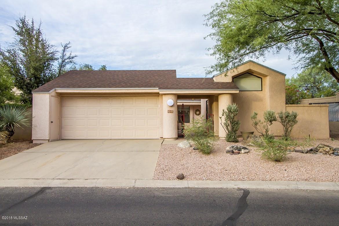 MOTIVATED SELLER...Lovingly updated single story patio home in Bosque Creek.  Two bedroom, two bath main house features vaulted ceilings, wood burning fireplace, spacious walk in closets, dual sinks in master bath.  Brand new carpeting, appliances, bath and lighting fixtures.  Guest house has full bath and AC.  New roof with 5 yr warranty on shingles and 4 yrs on roof coat. 1 yr termite warranty.  Courtyard entry, two car garage with built in storage on every wall.  Property backs up to mesquite bosque and open space.  In the heart of historic Old Ft Lowell neighborhood.  Close to restaurants and shopping at Palomino Plaza.  One year home warranty included.