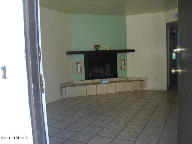 Invesment or Home w/investment!  In EACH unit: Spacious floor plan with wood burning fireplace. 2 Bdrm, 1 bath. Approx 864 sqft. Kitchen has full-size refrigerator and stove. Tiled throughout. Evap cooling. Covered parking; storage area off carport. Washer/dryer hookups. 3 blocks to Pima College downtown campus.
Pls do not disturb tenants. Unit 243 is vacant and has keysafe.