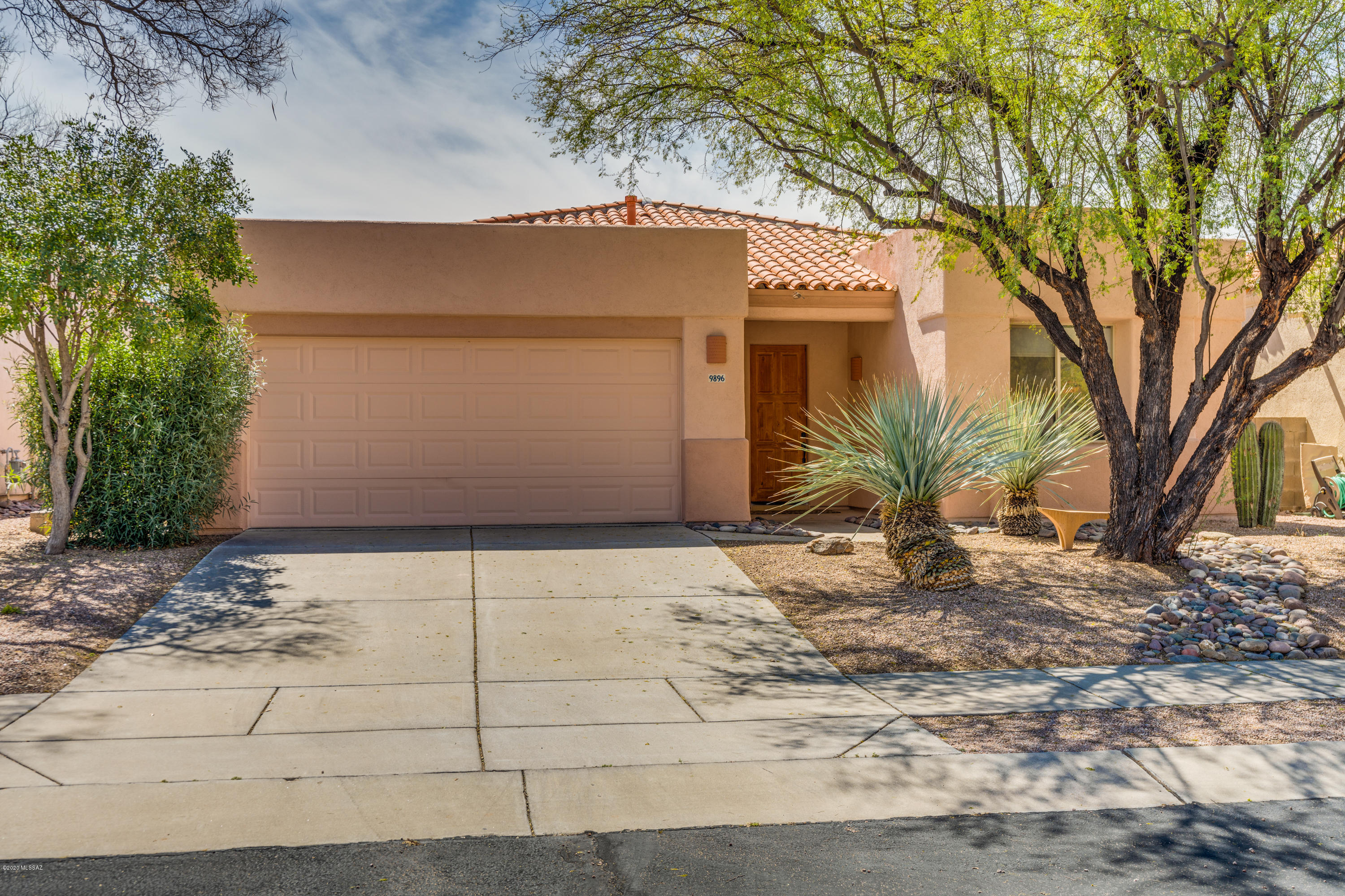 Seller will accept or counter offers between $349,000-$359,000.  This one is a WOW.  Beautifully designed and updated by Owner. Move-in Ready. 4 BD/ 2 BTH.  Split Plan.  Gorgeous Kitchen, Stainless Appliances, Quartz Counters highlighted with a rounded Granite Bar.  Ceiling Fans and Accent lighting.  Vaulted Ceilings throughout. Kitchen, Dining, and Breakfast Bar open to Great room with Fireplace, loads of Natural light. French Doors lead to covered patio, Lush Landscaping, Built-in Grill, Fountain, and Privacy for Entertaining. Nestled in the Gated Sabino Springs Golf Community in the Catalina Mountains - This is a Really Nice Home.