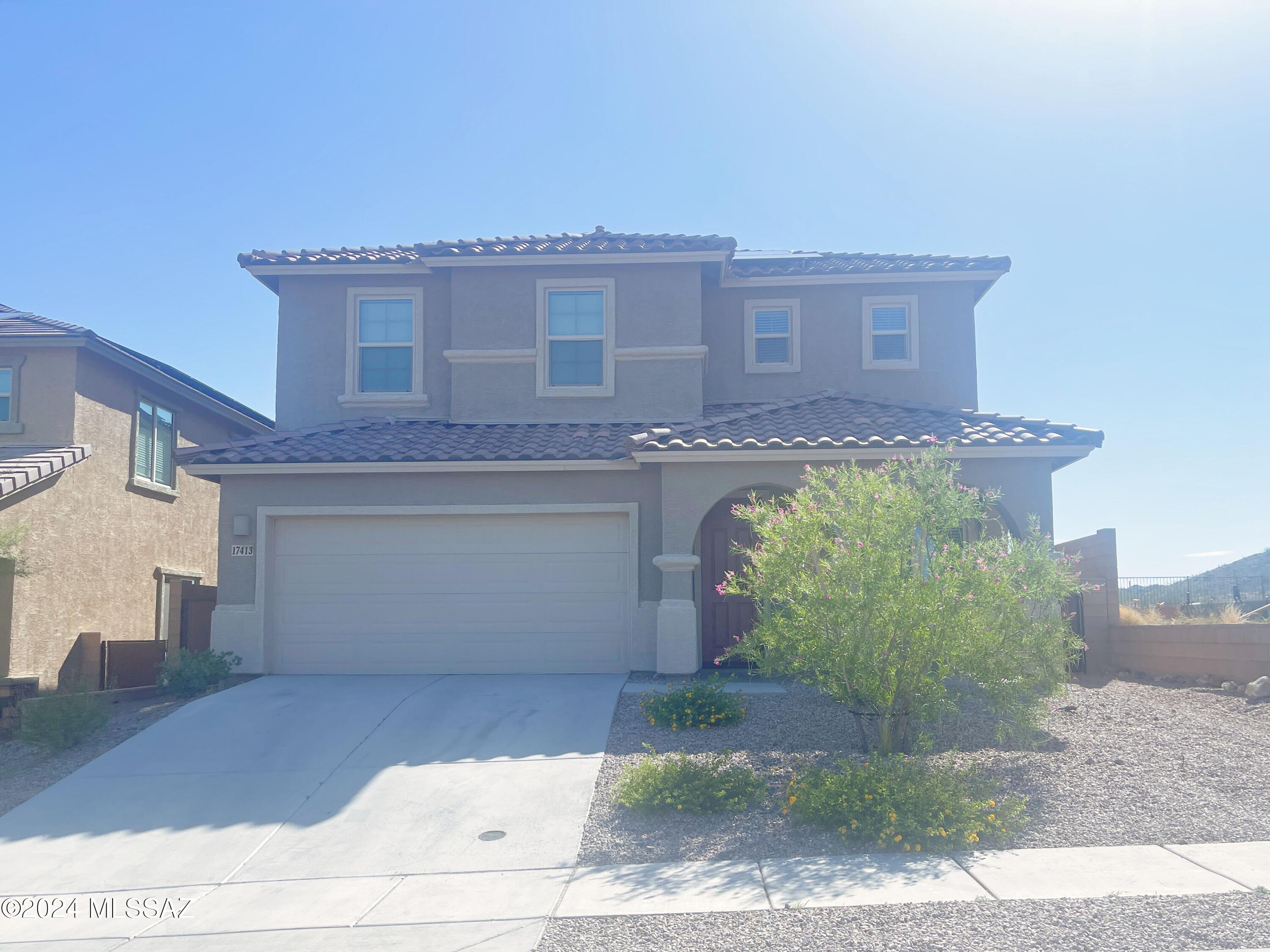 No Application Fees! Oversized 5 bedroom, 3 bathroom, beautiful veil home located in Santa Rita Ranch. You won't be disappointed with the amazing views at this home with mountain and city view from both the front backyard with no neighbors to the rear.  Substantial living space includes the front living room, larger family room, and huge loft upstairs. Beautiful kitchen features granite countertops, breakfast bar, large island, separate pantry, double oven, gas cooktop and all appliances. One full bedroom and full bathroom are located on the first floor.  Upstairs you will find four additional bedrooms including the large primary suite with massive walk-in closet, extended double sink vanity, garden tub and step in shower. Easy to maintain desert landscaping with incredible views. $500 off 1st months rent. This home has solar, and is expected to result in a significant electricity bill cost savings. There is no additional solar fee.