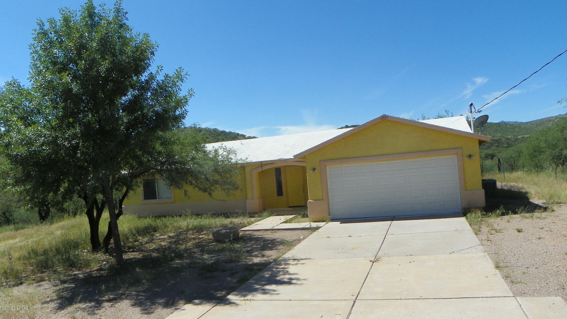 This is a fixer upper with 3 BR and 2 baths on a corner lot with fenced yard.
